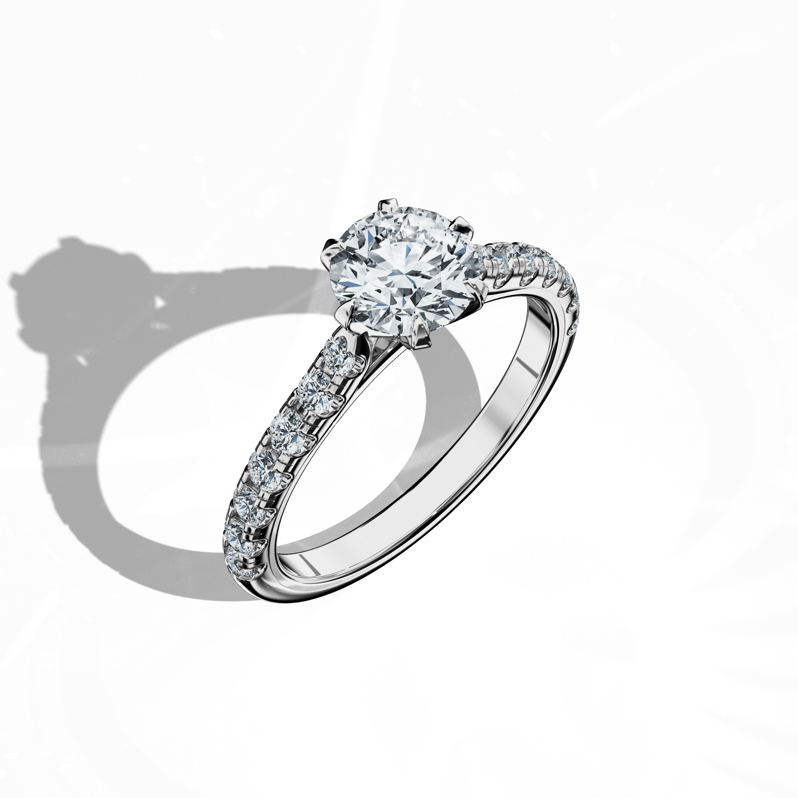 Front top side view of a white gold solitaire paved ring with a total of 1.21 ct diamond weight, featuring a 1 ct center/centre diamond and 0.21 ct side diamonds set in a slim band with a four nail prong design. This dynamic perspective reveals detailed craftsmanship and contemporary style, ideal as an engagement ring, bridal jewelry/jewellery, or fine jewelry/fine jewellery piece. Keywords: white gold, paved ring, diamond slim band, luxury, 1.21 ct, detailed craftsmanship.