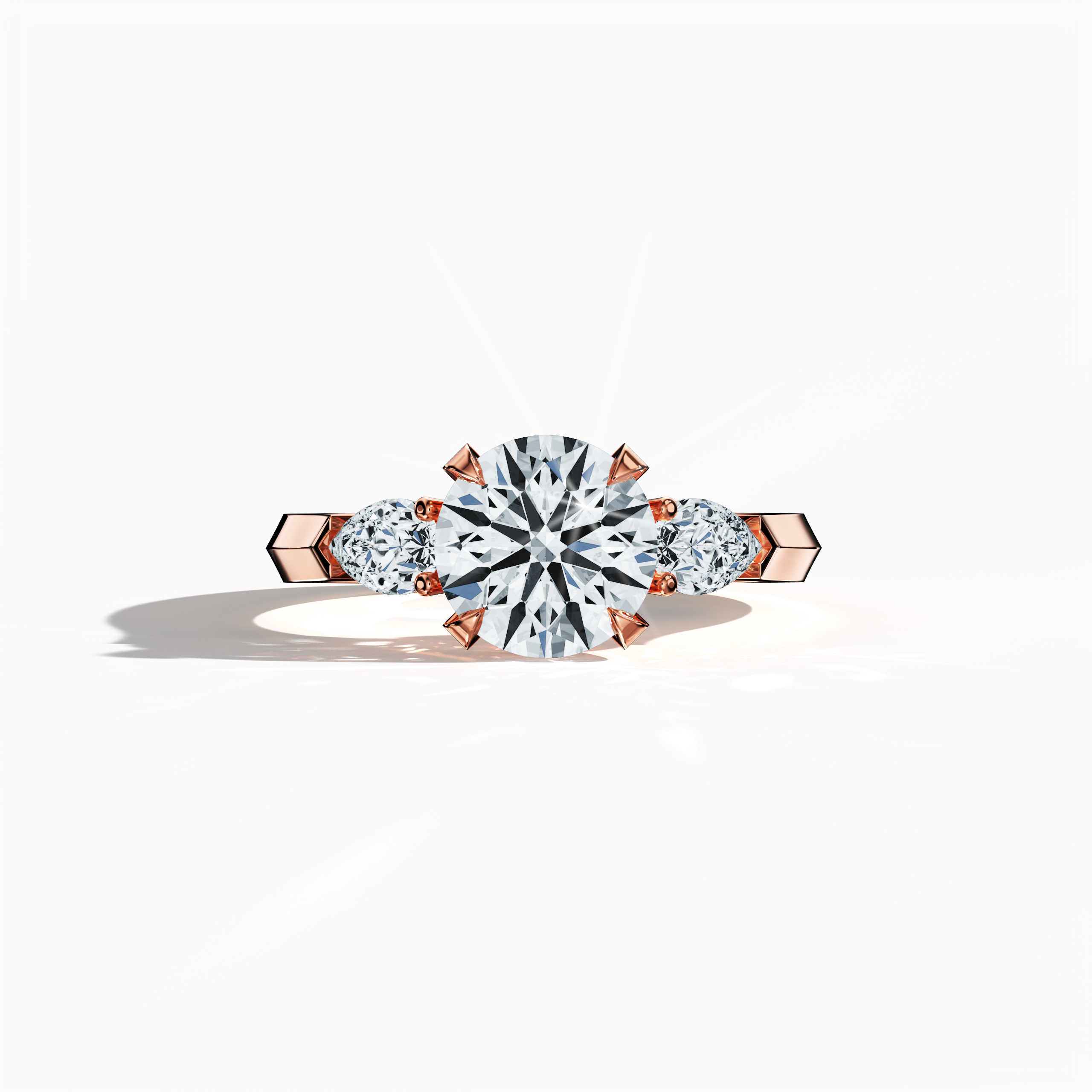 Rose gold trilogy diamond ring featuring 2.55 ct natural diamonds—a captivating 2 ct round center/centre diamond flanked by two pear‐shaped side diamonds (0.55 ct total). Captured in a sleeping front view, its warm blush tone and refined four‐nail prong setting radiate elegance as an engagement ring, wedding band, or fine jewelry/fine jewellery piece. Also known as a trilogy ring, three‐stone ring, three‐diamond ring, trinity ring, and triptych ring design. Keywords: rose gold, elegant, luxury.