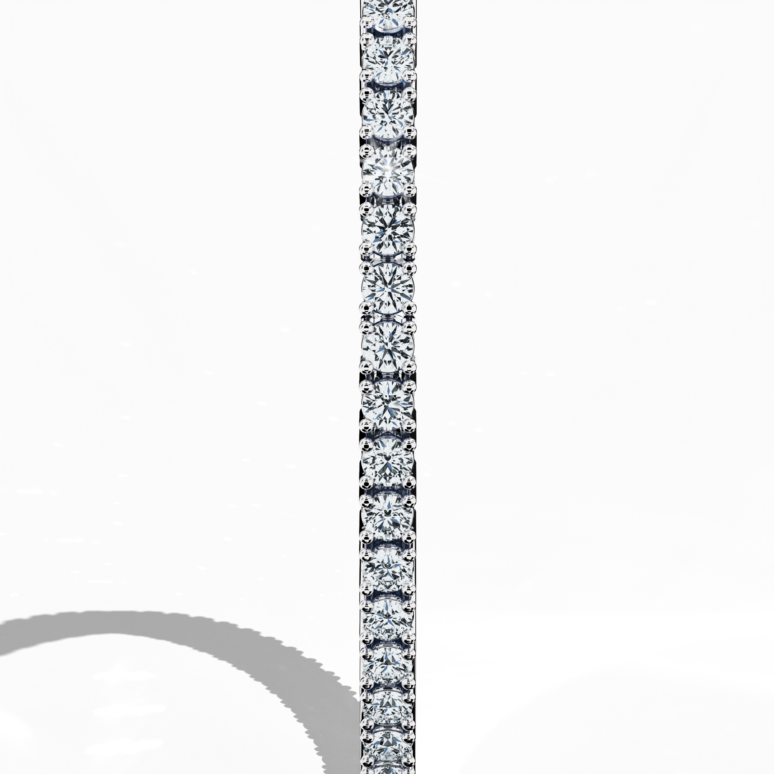 In a standing side view, this 4 carat diamond tennis bracelet in white gold (alternatively called grey gold or palladium gold) reveals a graceful profile with a seamless band of prong-set round brilliant diamonds. Also known as a tennis bracelet, line bracelet, eternity bracelet, river bracelet, or inline bracelet, its precise four‐prong design accentuates each diamond’s natural sparkle, making it ideal for upscale occasions and refined everyday wear. Keywords: diamond tennis bracelet, 4 carat, white gold,