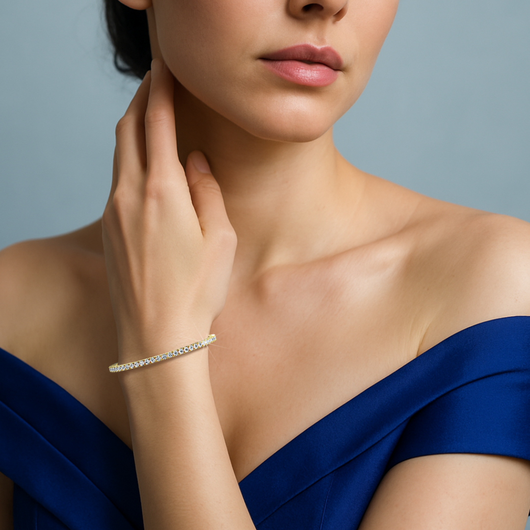 This 7-carat diamond tennis bracelet in yellow gold (sometimes labeled classic gold or champagne gold) is worn on a woman's wrist, illustrating its timeless charm and shimmering row of round diamonds. Known as a line bracelet, eternity bracelet, river bracelet, or inline bracelet, it offers both durability and elegance. A prong-set design ensures maximum brilliance, making it ideal for daily wear or formal events. Keywords: diamond tennis bracelet, yellow gold, line bracelet.