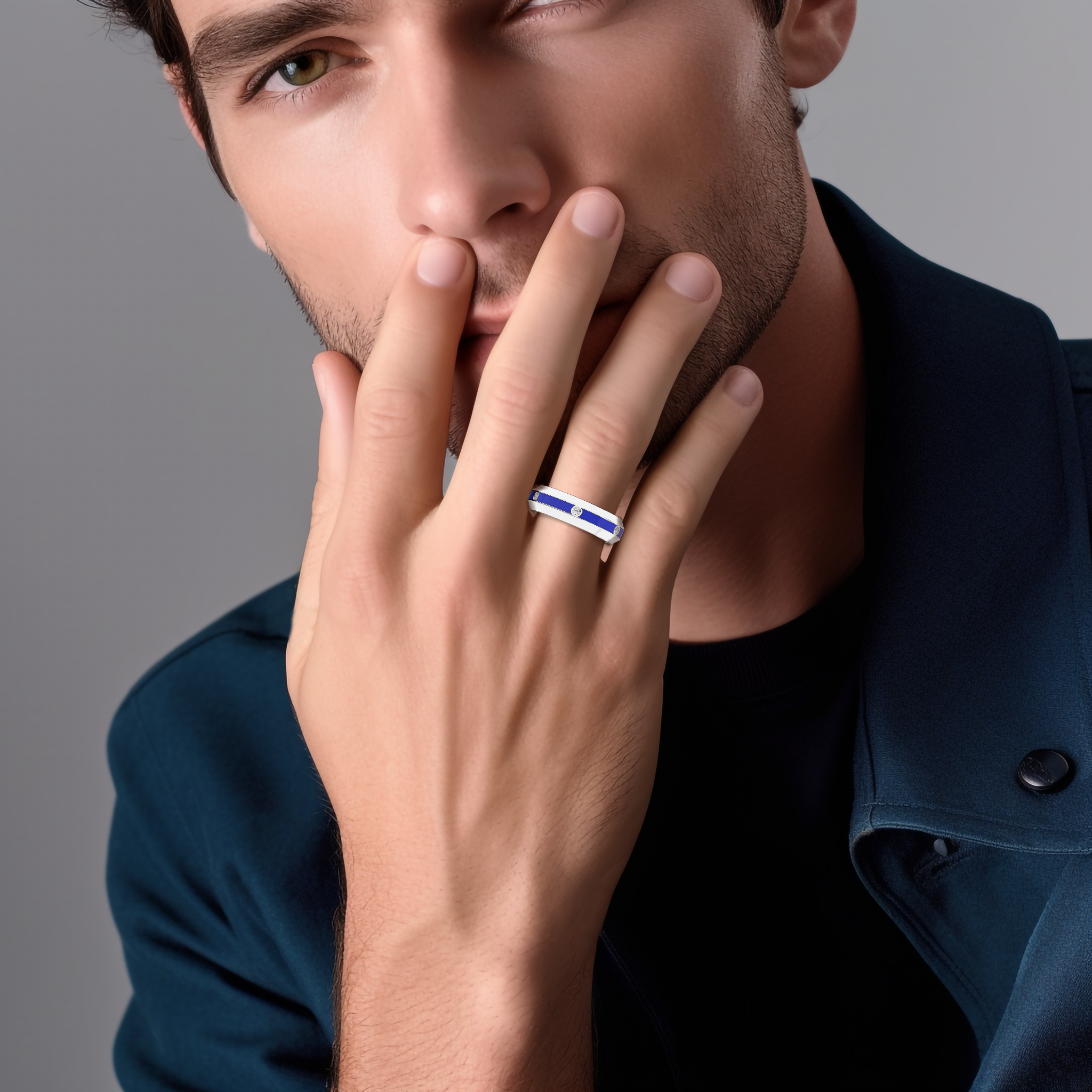 Worn on a model’s finger, this six diamond center step enamel ring in white gold with vivid blue glossy enamel exudes sophistication and charm. The 0.20-carat diamond row, paired with the dynamic ‘Sterling Radiance’ and ‘Icy Blue Brilliance’ design elements, reflects a fusion of modern innovation and timeless luxury. The image highlights premium craftsmanship and a distinctive, international appeal. Keywords: white gold, blue enamel, diamond ring, luxury, designer, elegant, modern.