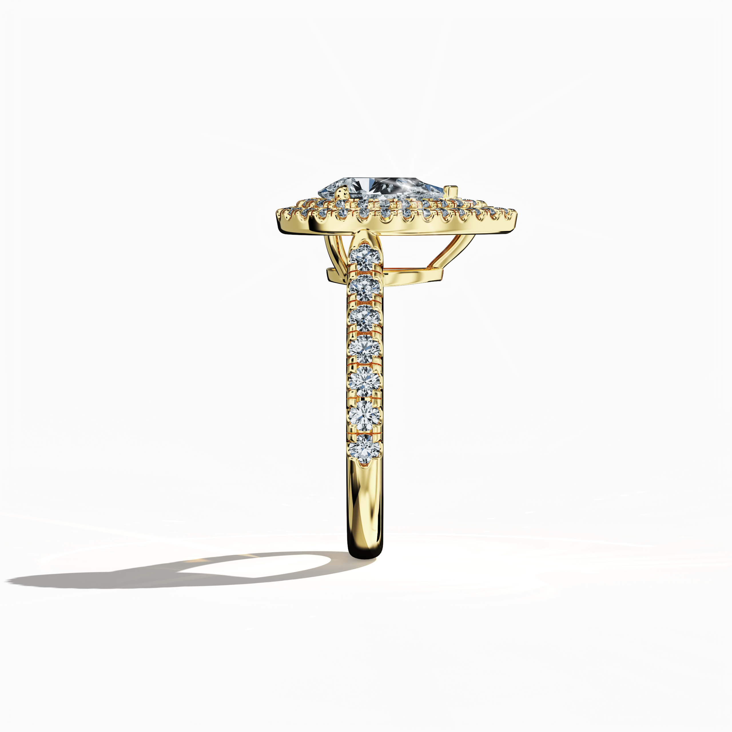Detailed side view image of an elegant double halo diamond ring in radiant yellow gold (classic gold/sunlit gold). The ring’s profile showcases a 1ct pear‐cut center diamond—alternatively termed teardrop or waterdrop—flanked by up to 1ct of precisely paved side diamonds. Highlighting design variations such as double halo, pavé halo, twin halo, cathedral halo, vintage halo, and contemporary halo, this perspective emphasizes sleek contours, luxury detailing, and global design finesse.