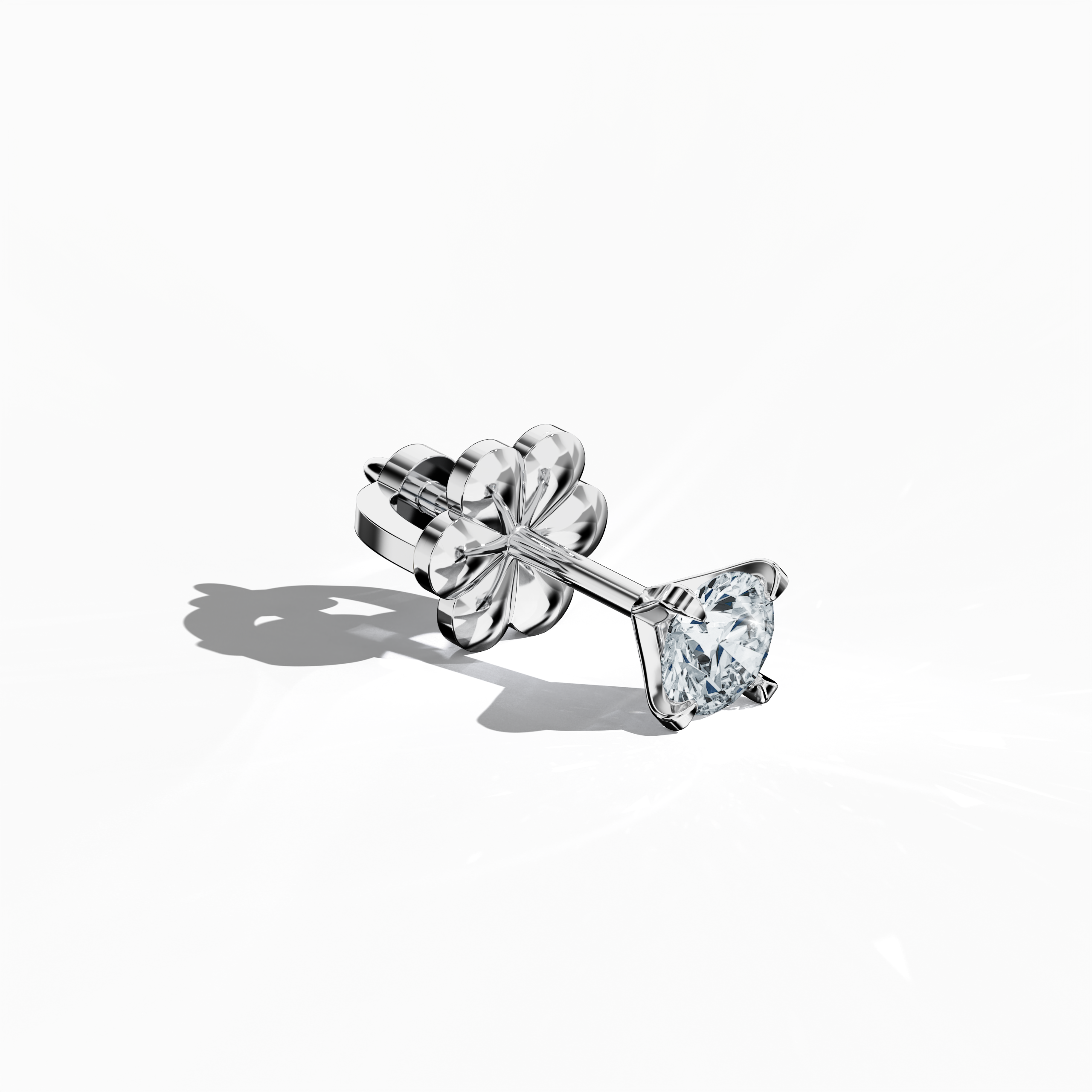Front top side view of 0.60 carat natural diamond earring in 18k white gold with nail prong setting; diamond stud, 0.60ct solitaire diamond, luxury fine jewelry/fine jewellery ear accessory.