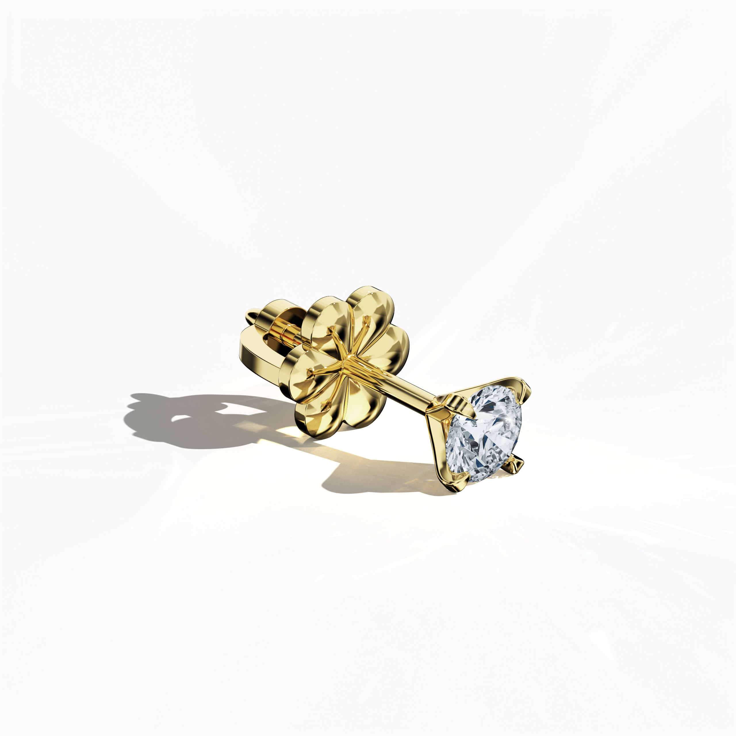 Front top side view of 0.60 carat natural diamond earring in 18k yellow gold with nail prong setting; diamond stud, 0.60ct solitaire diamond, luxury fine jewelry/fine jewellery ear accessory.
