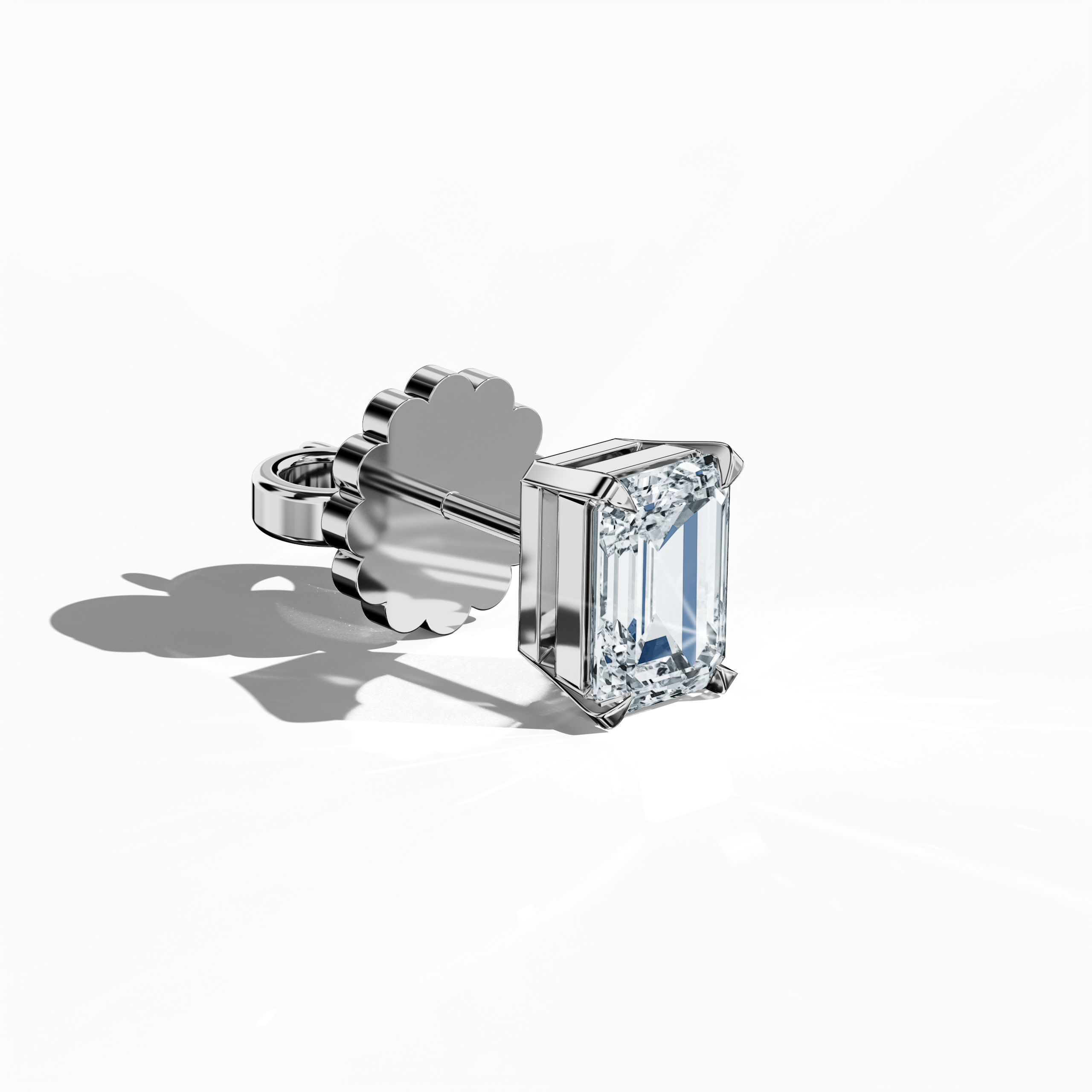 Front top side view of 1-carat natural emerald earring in 18k white gold with prong setting; emerald stud, 1ct natural emerald, luxury fine jewelry/fine jewellery ear accessory.