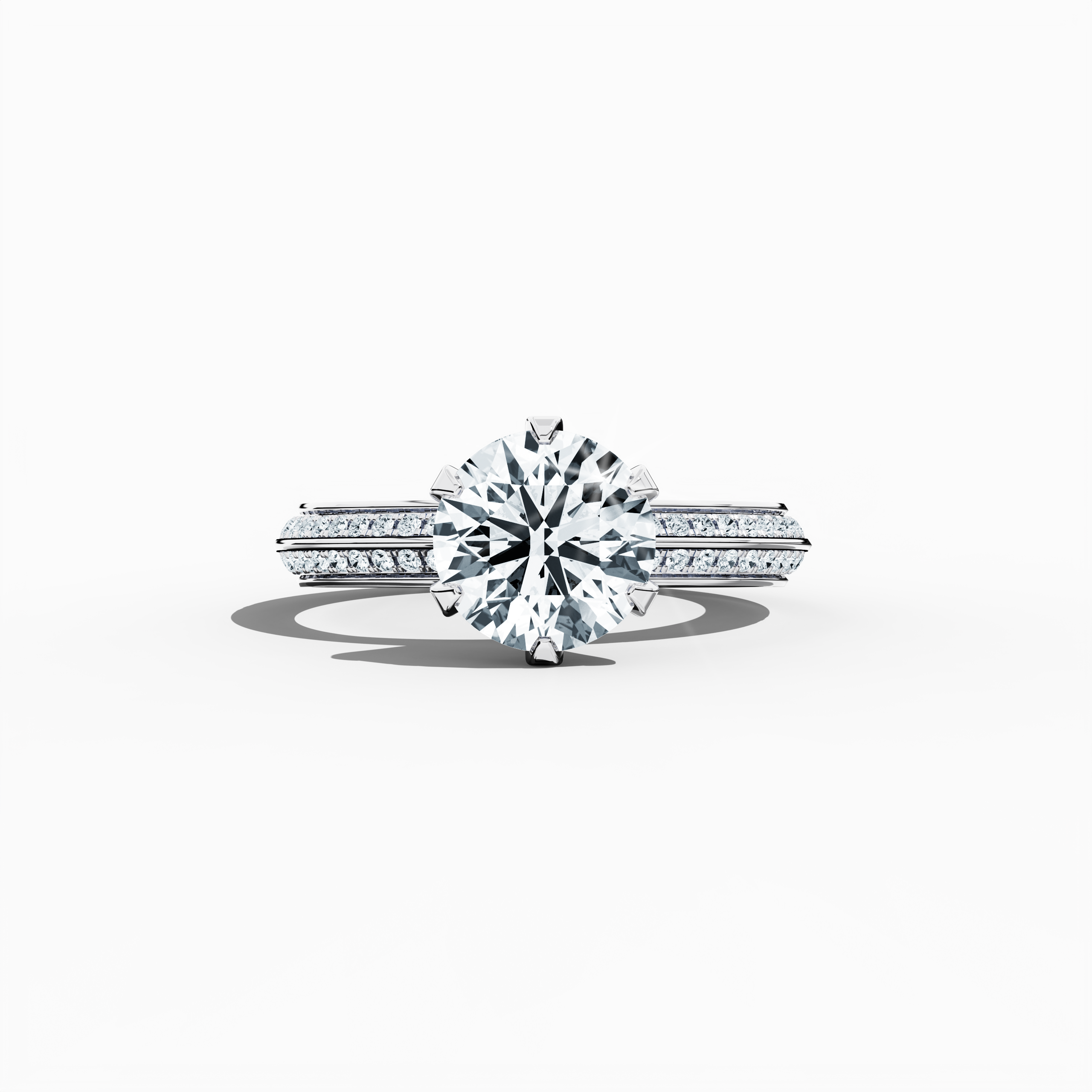 Solitaire paved ring with a total of 2.40 ct diamonds—featuring a 2 ct center diamond and 0.40 ct pavé side stones—set in a bright white gold band with a modern two‑step design and a sharp central line. Shown in a sleeping front view on a flat surface, this fine jewelry/fine jewellery ring radiates sleek sophistication and luminous brilliance.
