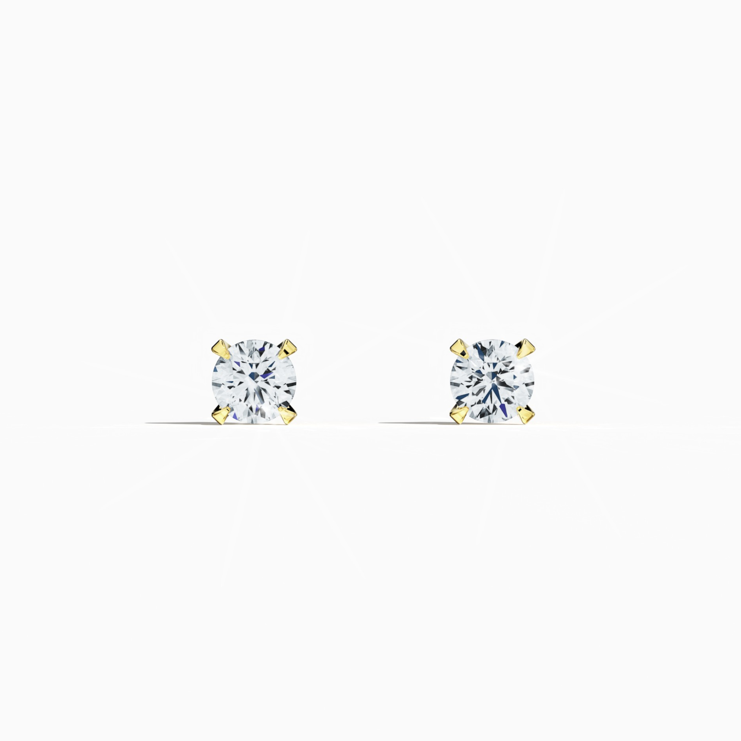Front view of 1 carat natural diamond earring in 18k yellow gold with nail prong setting; diamond stud, 1ct solitaire diamond, luxury fine jewelry/fine jewellery ear accessory.