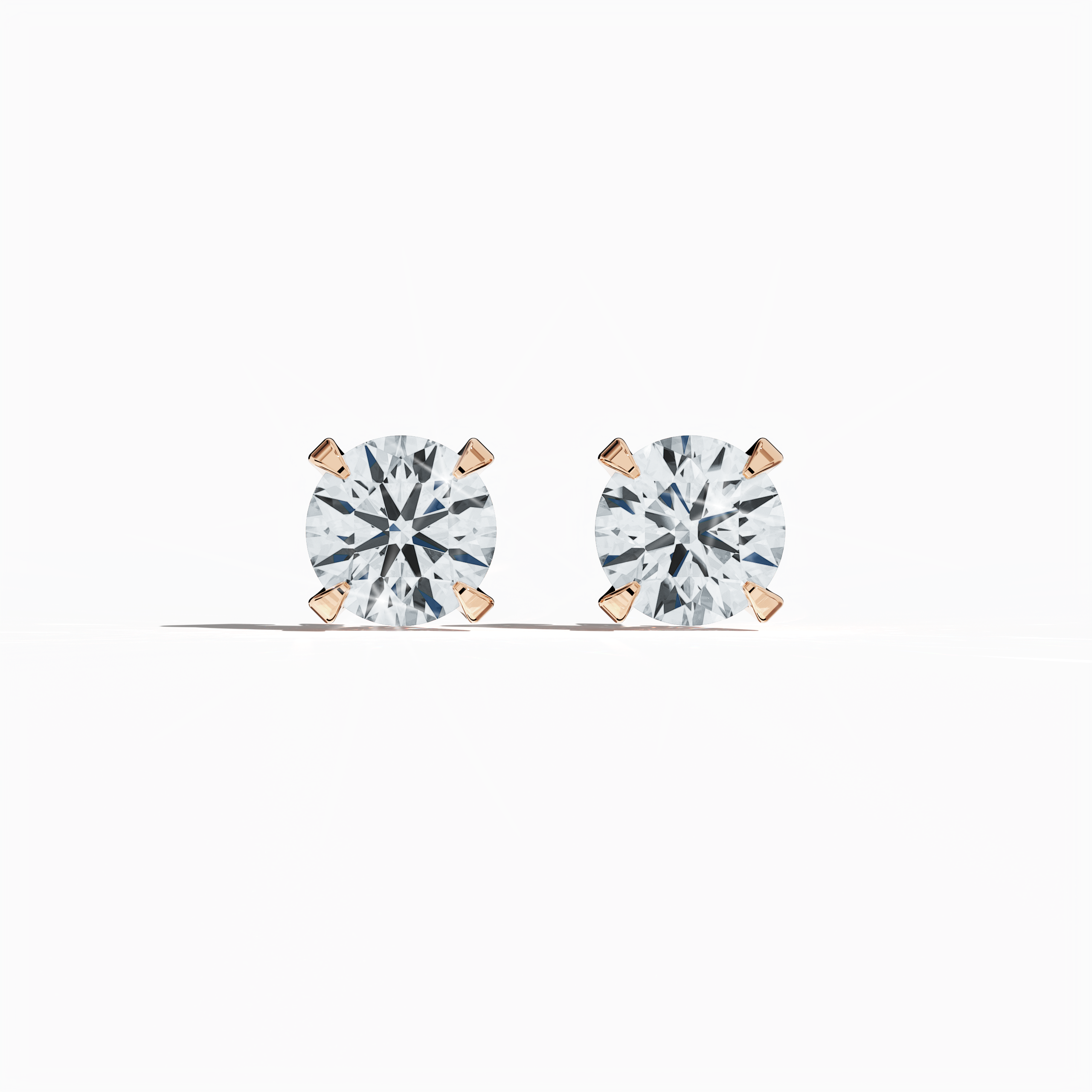 Front view of 2 carat natural diamond earring in 18k rose gold with nail prong setting; diamond stud, 2ct solitaire diamond, luxury fine jewelry/fine jewellery ear accessory.