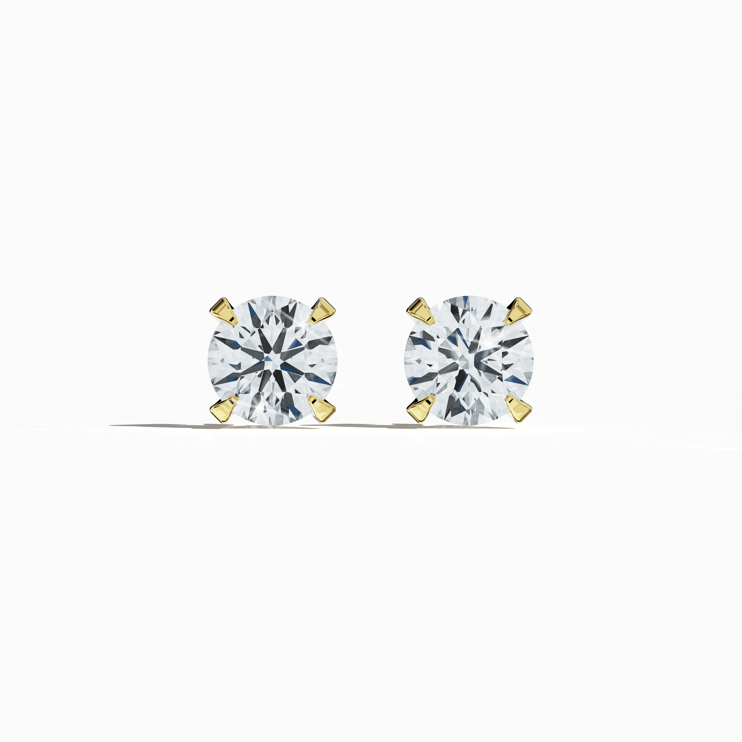Front view of 2 carat natural diamond stud earrings in classic basket and Nail Prong/claw settings, crafted in 18k yellow gold.