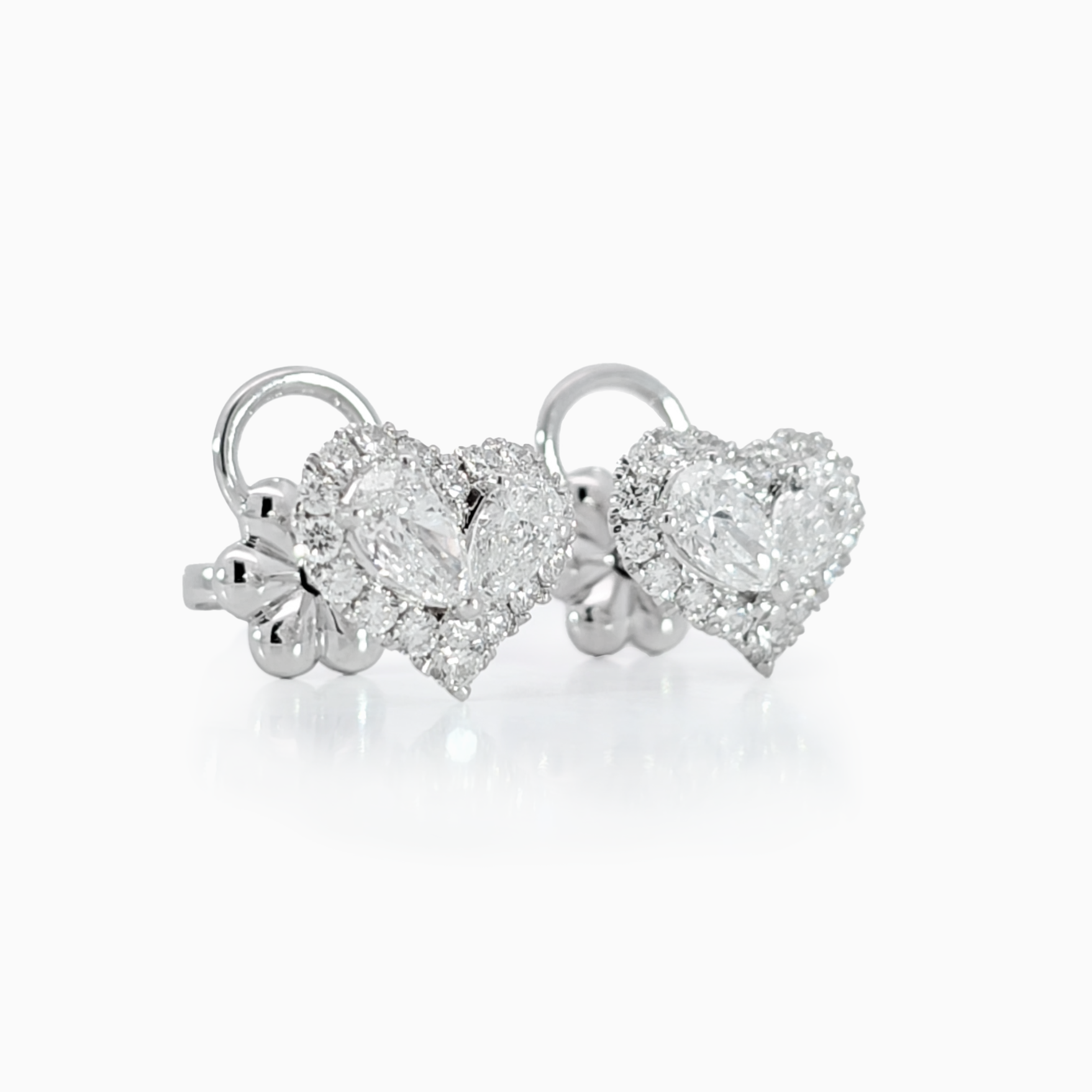 Heart shaped pear diamond halo Earring showing 0.30 carat pear diamonds with halo setting in 18K white gold