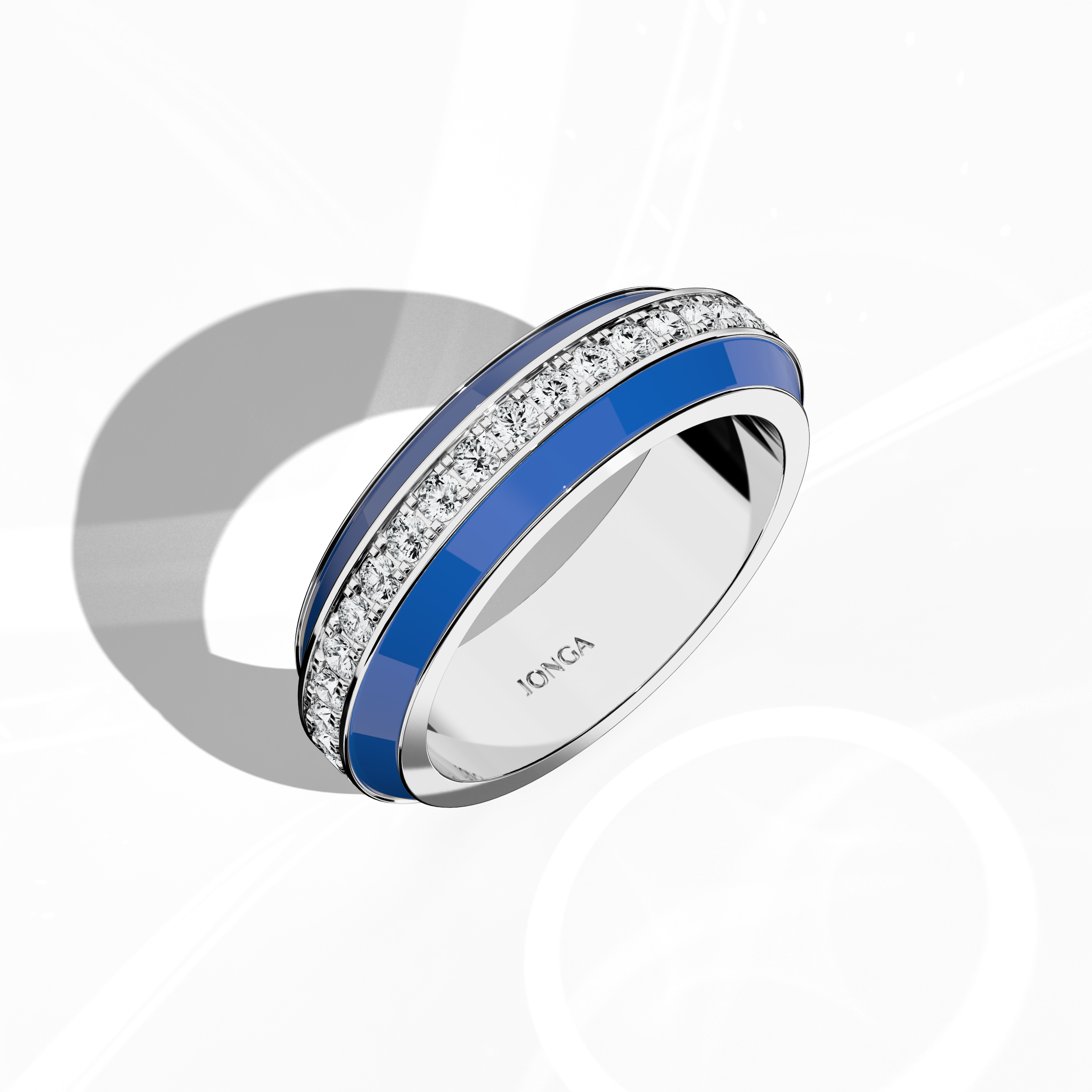 Admire the distinctive profile of this white gold ring, set off by radiant blue glossy enamel and an up to 1 carat diamond paved in the center line. Viewed from a standing front top side perspective, the intricate pave band—termed Eternity Pave, Pavé Chic, and Carat Pave—showcases detailed diamond pavé work that accentuates white gold’s brilliance. This design merges modern sophistication with luxurious craftsmanship for a striking statement.
Keywords: enamel, diamond, pave, luxury, designer.