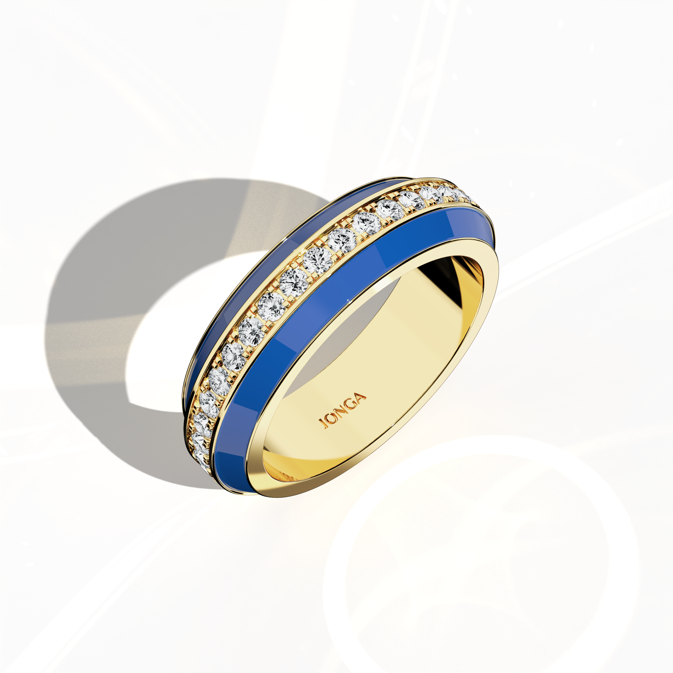 Admire the captivating profile of this yellow gold ring, accentuated by dynamic blue glossy enamel and an up to 1 carat diamond paved in the center line. Viewed from a standing front top side angle, the intricate pave band—termed Eternity Pave, Pavé Chic, and Carat Pave—showcases detailed diamond pavé work that highlights the radiant fusion of blue enamel with warm yellow gold. This designer creation epitomizes modern luxury and artistic finesse.
Keywords: enamel, diamond, pave, luxury, designer.