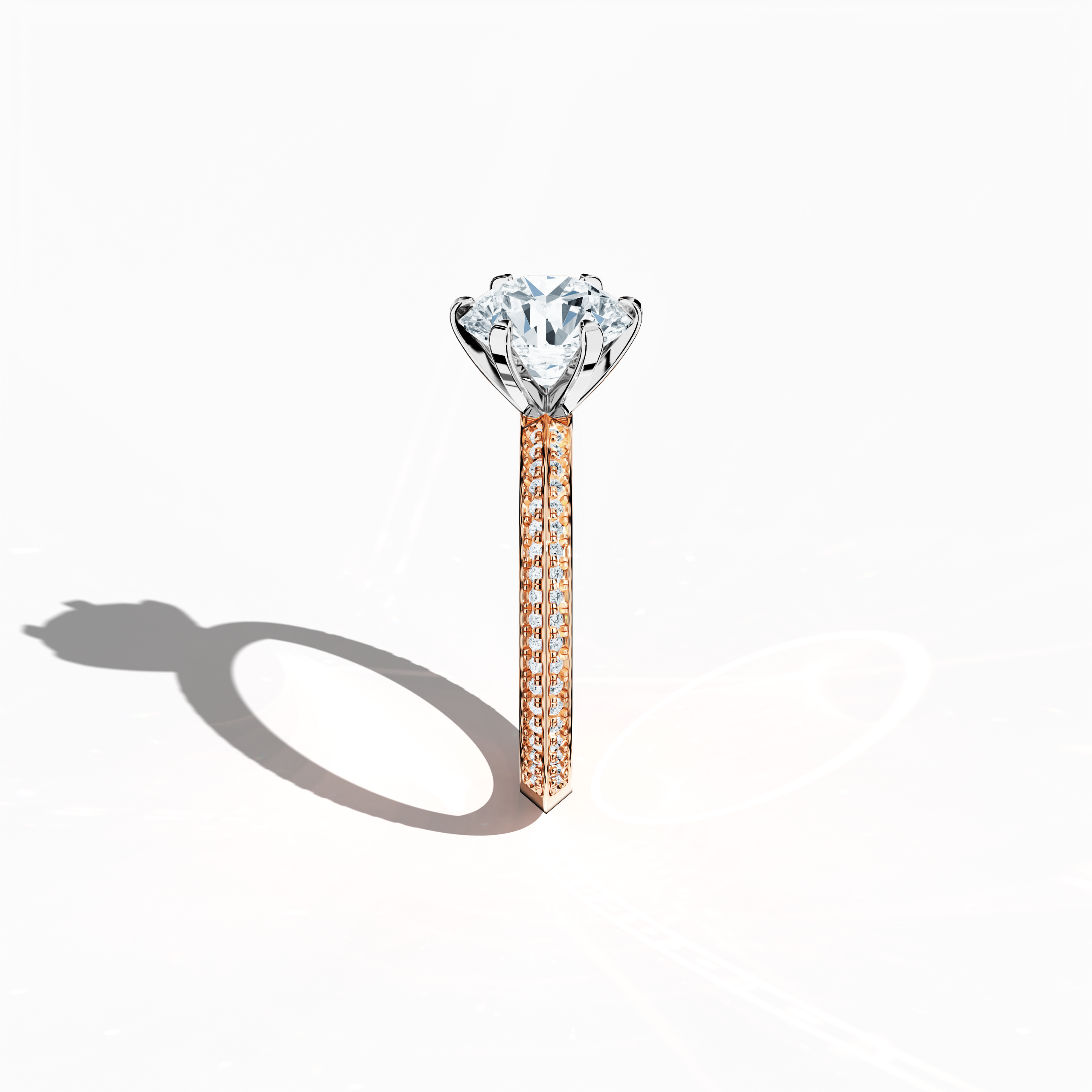 Refined solitaire paved ring with 2.40 ct total diamonds (2 ct center, 0.40 ct side stones) in a six‑prong setting and a two‑step band with a sharp central line, set in soft rose gold (blush/pink gold). Photographed from a standing side view, this fine jewelry/fine jewellery ring showcases its elegant contours and warm, romantic allure.