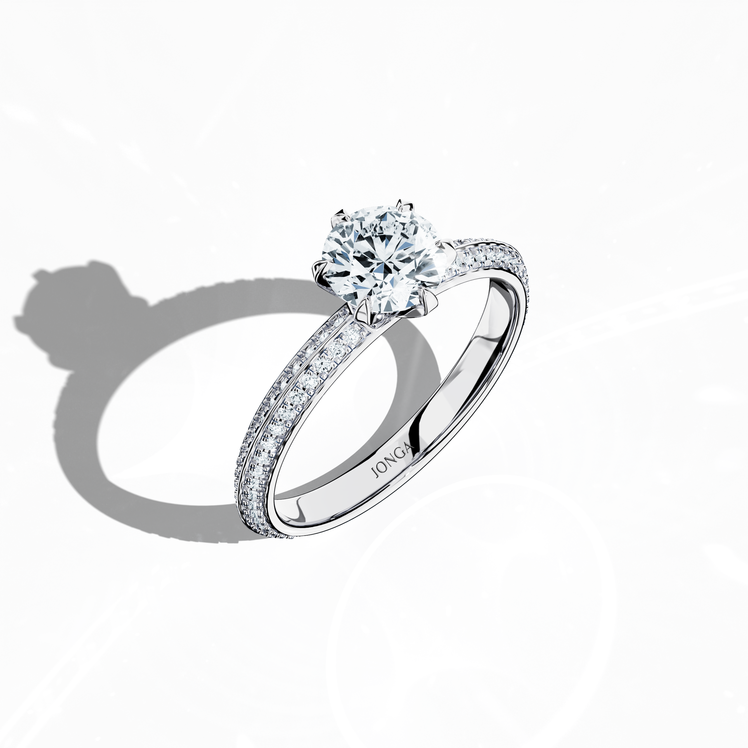 Modern 1.40 ct paved diamond ring featuring a 1 ct center diamond and 0.40 ct pavé side stones, set in bright white gold with a dual‑tier, step-designed band and a defined central line. Captured from a front top side angle, this fine jewelry/fine jewellery ring emphasizes its refined pavé setting and luminous finish.