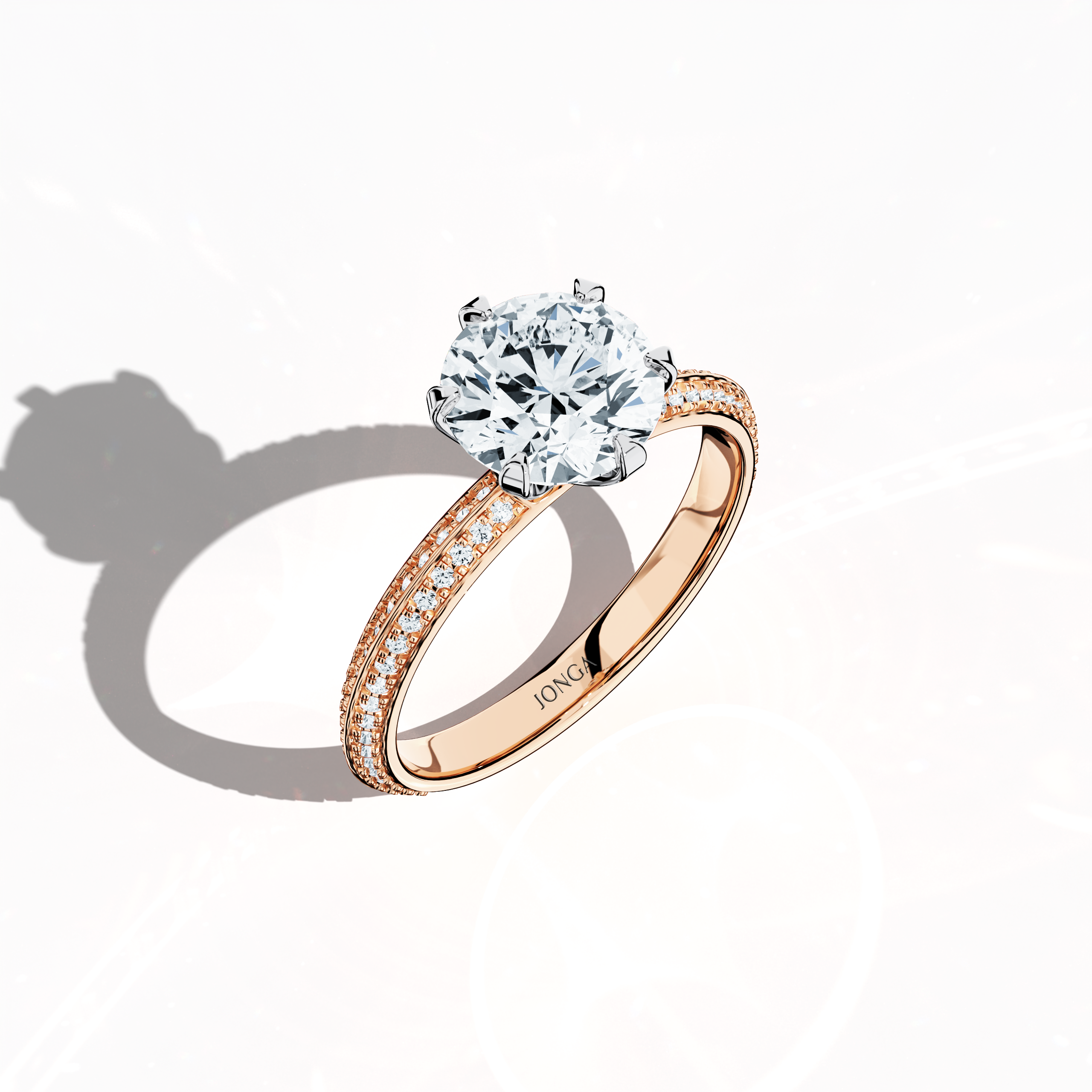 Modern 2.40 ct solitaire paved ring featuring a 2 ct center diamond and 0.40 ct pavé side stones, set in soft rose gold (blush/pink gold) with a dual‑tier, step‑designed band and a defined central line. Captured from a front top side angle, this fine jewelry/fine jewellery ring emphasizes its intricate pavé setting and gentle, luminous finish.