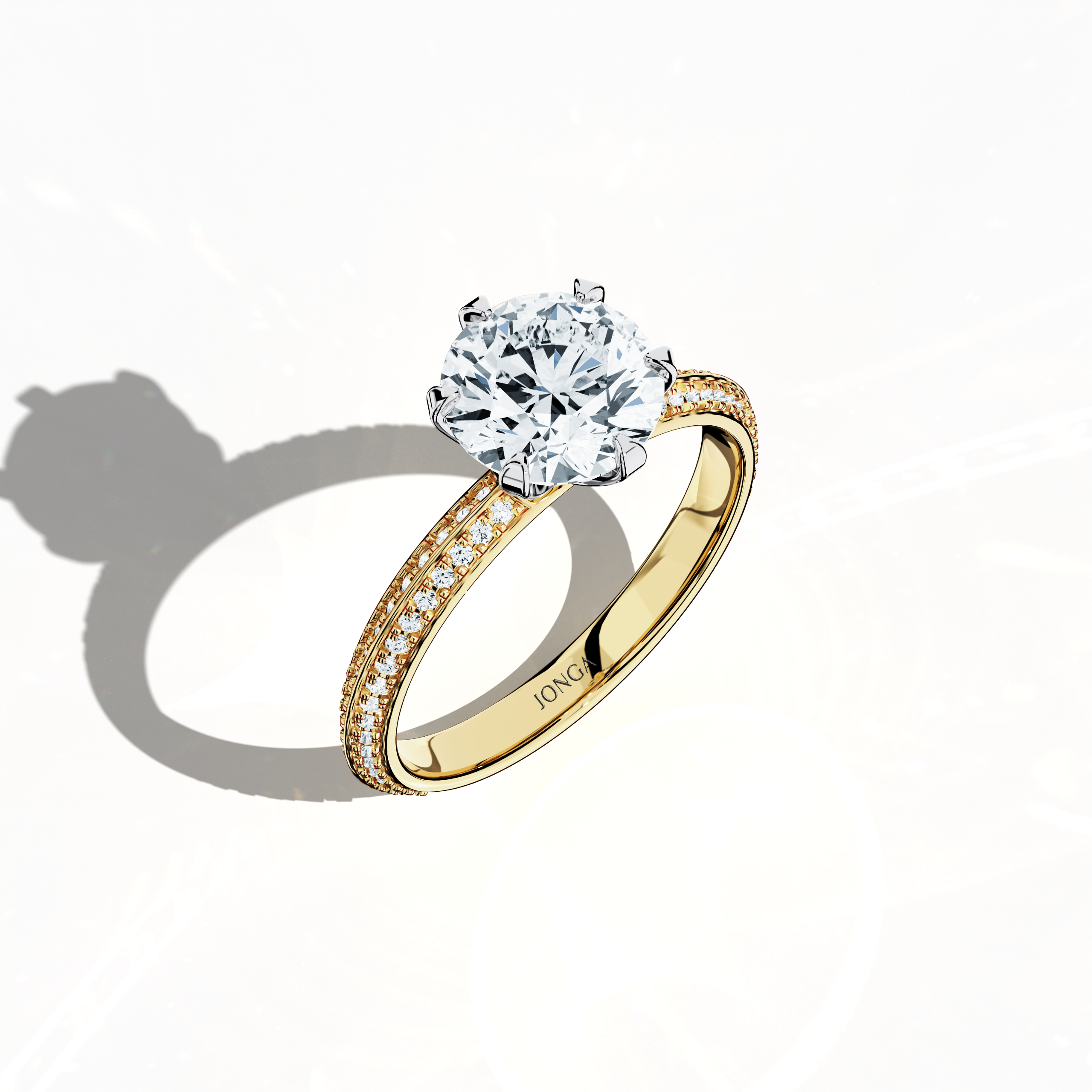 Modern 2.40 ct solitaire paved ring with a 2 ct center diamond and 0.40 ct pavé side stones, set in a classic yellow gold band with a dual‑tier, step‑designed band and a defined central line. Captured from a front top side angle, this fine jewelry/fine jewellery ring emphasizes its refined pavé setting and warm, vibrant allure.