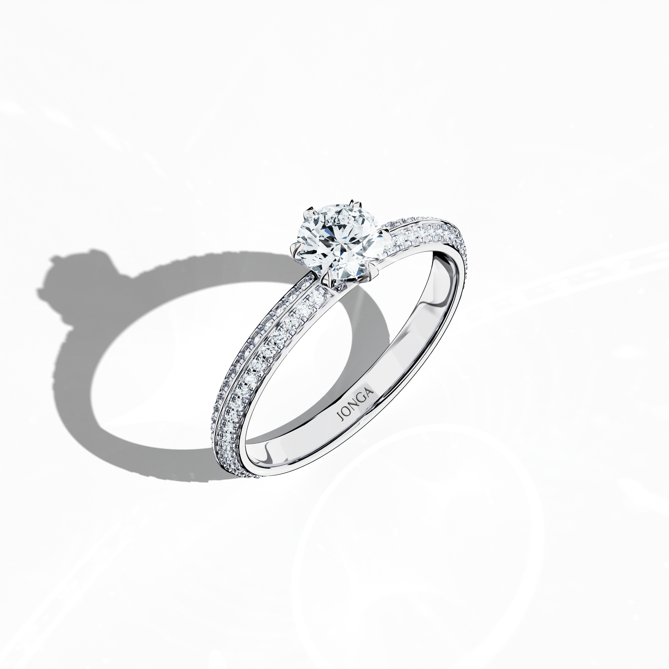 Modern 0.90 ct solitaire paved ring featuring a 0.50 ct center diamond and 0.40 ct pavé side stones, set in bright white gold with a dual‑tier, step‑designed band and a striking central line. Captured from a front top side angle, this fine jewelry/fine jewellery ring emphasizes its refined pavé setting and clean, silvery finish.