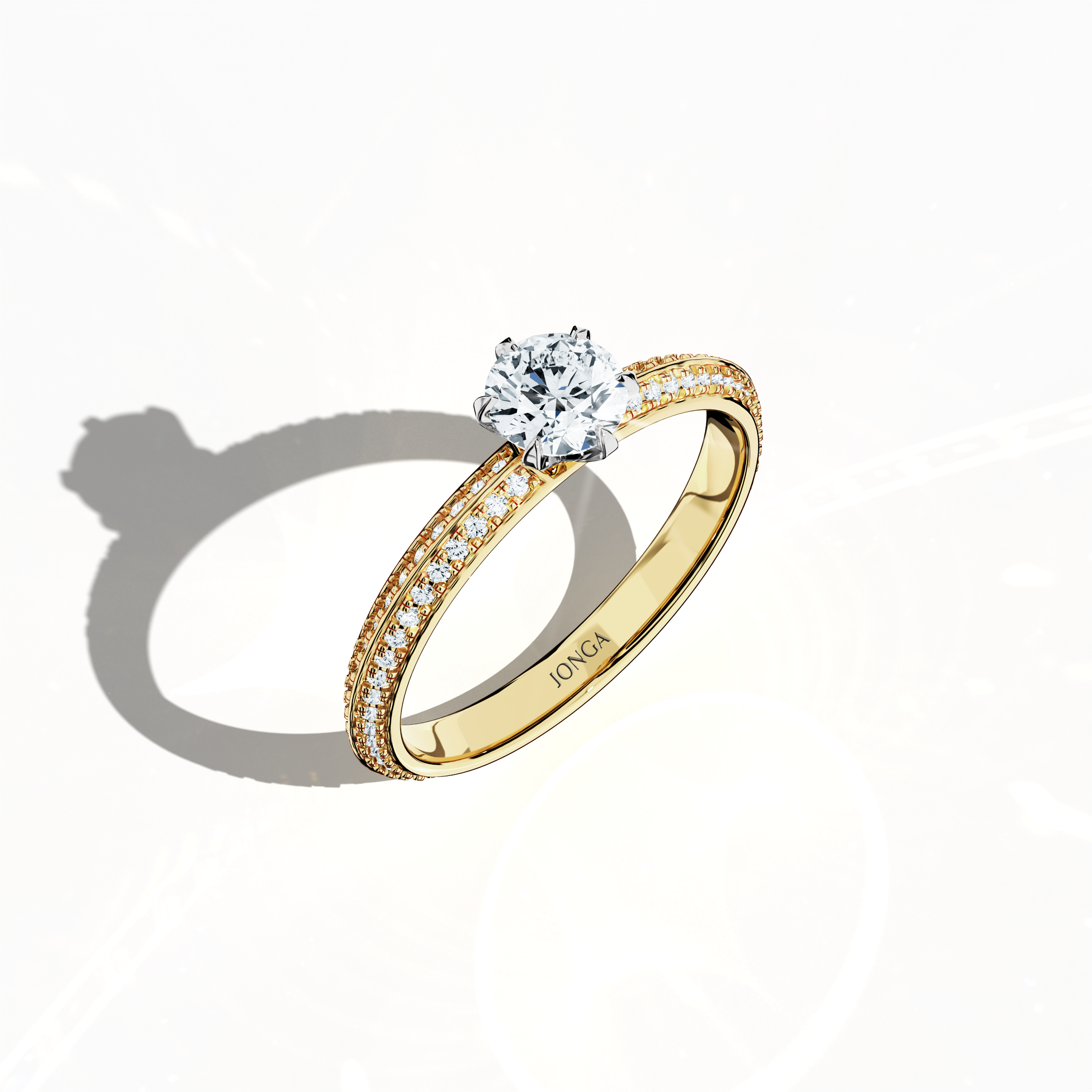 Modern 0.90 ct solitaire paved ring featuring a 0.50 ct center diamond and 0.40 ct pavé side stones, set in a classic yellow gold band with a dual‑tier, step‑designed band and a defined central line. Captured from a front top side angle, this fine jewelry/fine jewellery ring emphasizes its refined pavé setting and warm, radiant allure.