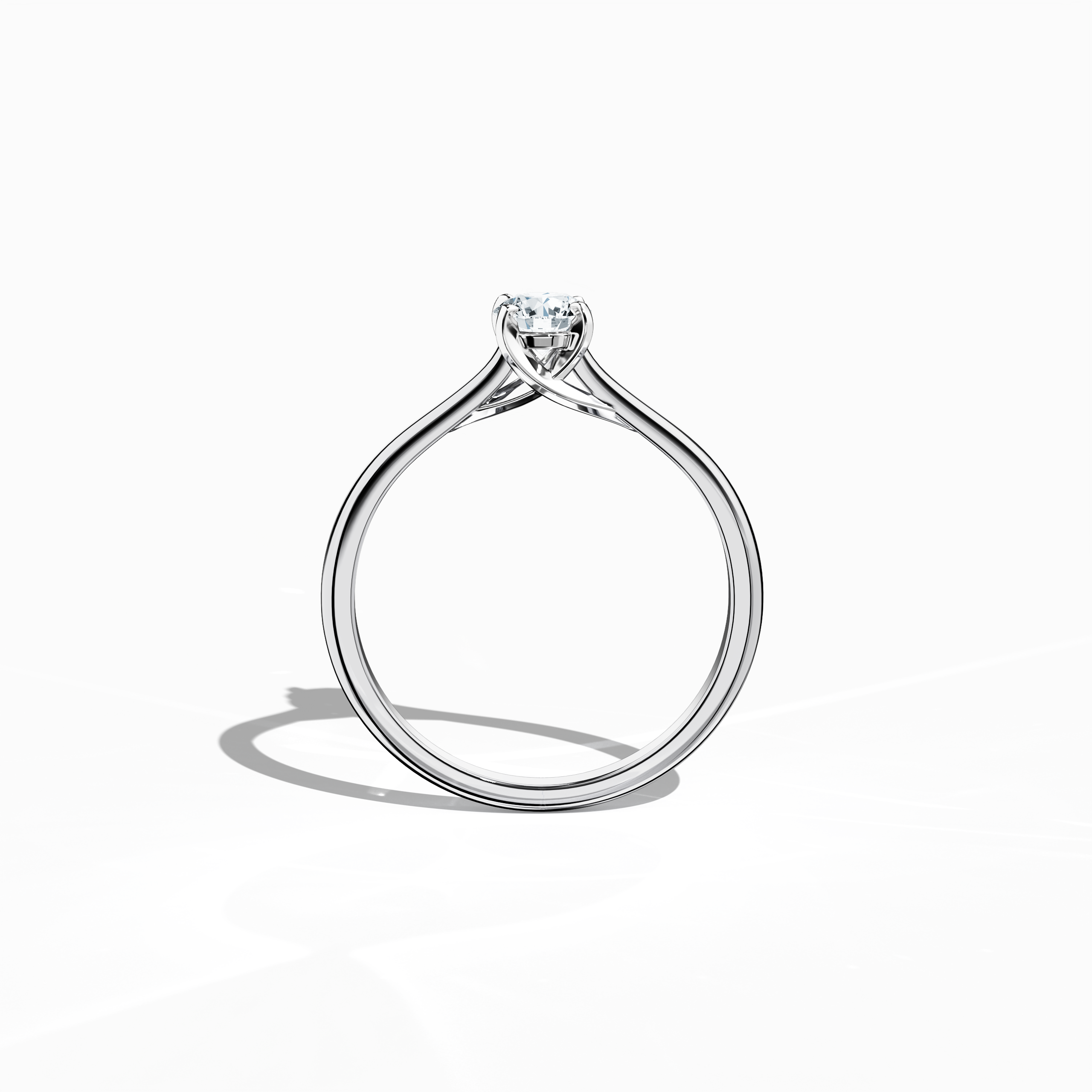 Refined solitaire diamond ring with a 0.30 ct center stone in a unique twisted bottom design, supported by four‑tap prongs in white gold and a bright white gold band. Photographed from a standing front view, this fine jewelry/fine jewellery ring exhibits modern elegance and a crisp, luminous profile.