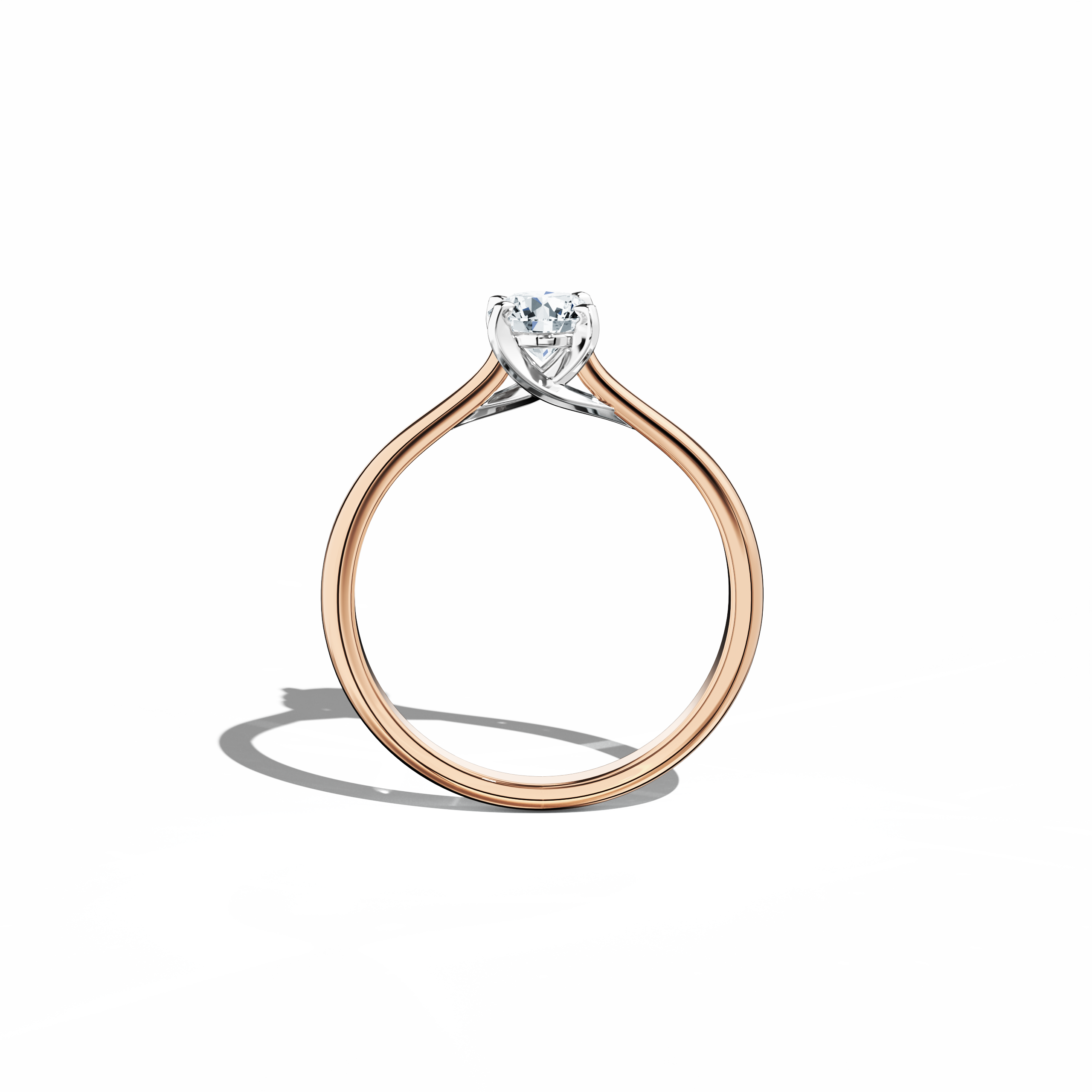 Refined solitaire diamond ring with a 0.50 ct center stone in a unique twisted bottom setting, secured by four‑tap prongs in white gold and paired with a soft rose gold band (blush/pink gold). Shown from a standing front view, this fine jewelry/fine jewellery ring exemplifies modern romance and sophisticated design with a warm, radiant glow.
