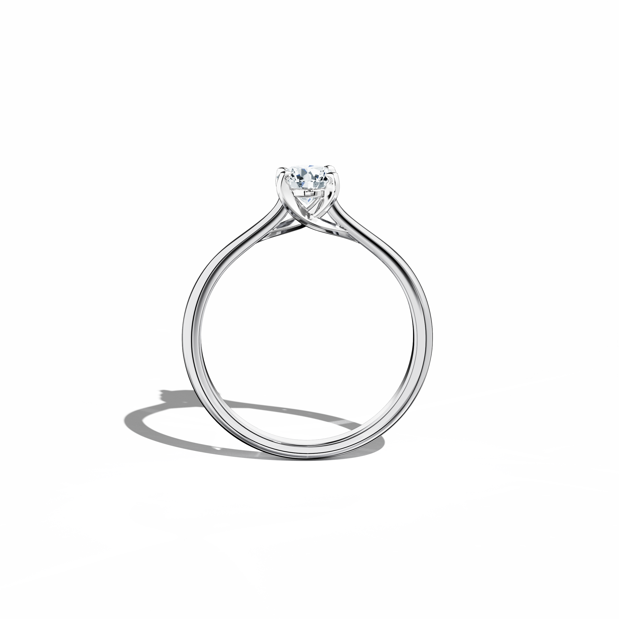 Refined solitaire diamond ring with a 0.50 ct center stone in a unique twisted bottom setting, secured by four‑tap prongs in white gold and complemented by a bright white gold band. Photographed from a standing front view, this fine jewelry/fine jewellery ring exhibits a crisp, modern silhouette and radiant finish.