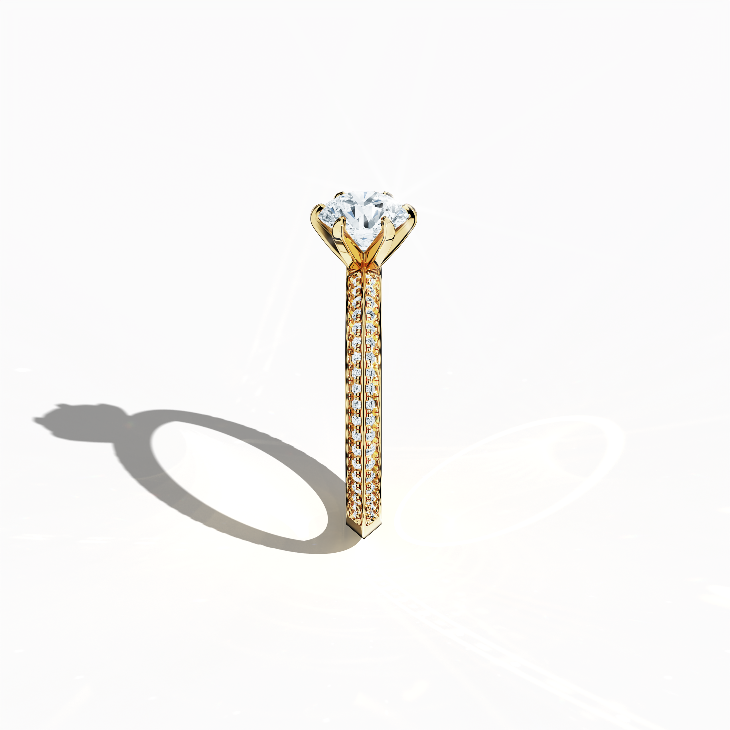Refined solitaire paved ring with 1.40 ct diamonds – a 1 ct center stone and 0.40 ct pavé side stones – set in rich yellow gold with a two‑step band featuring a sharp central accent. Photographed from a standing side view, this fine jewelry/fine jewellery ring showcases elegant contours and vibrant, warm allure.