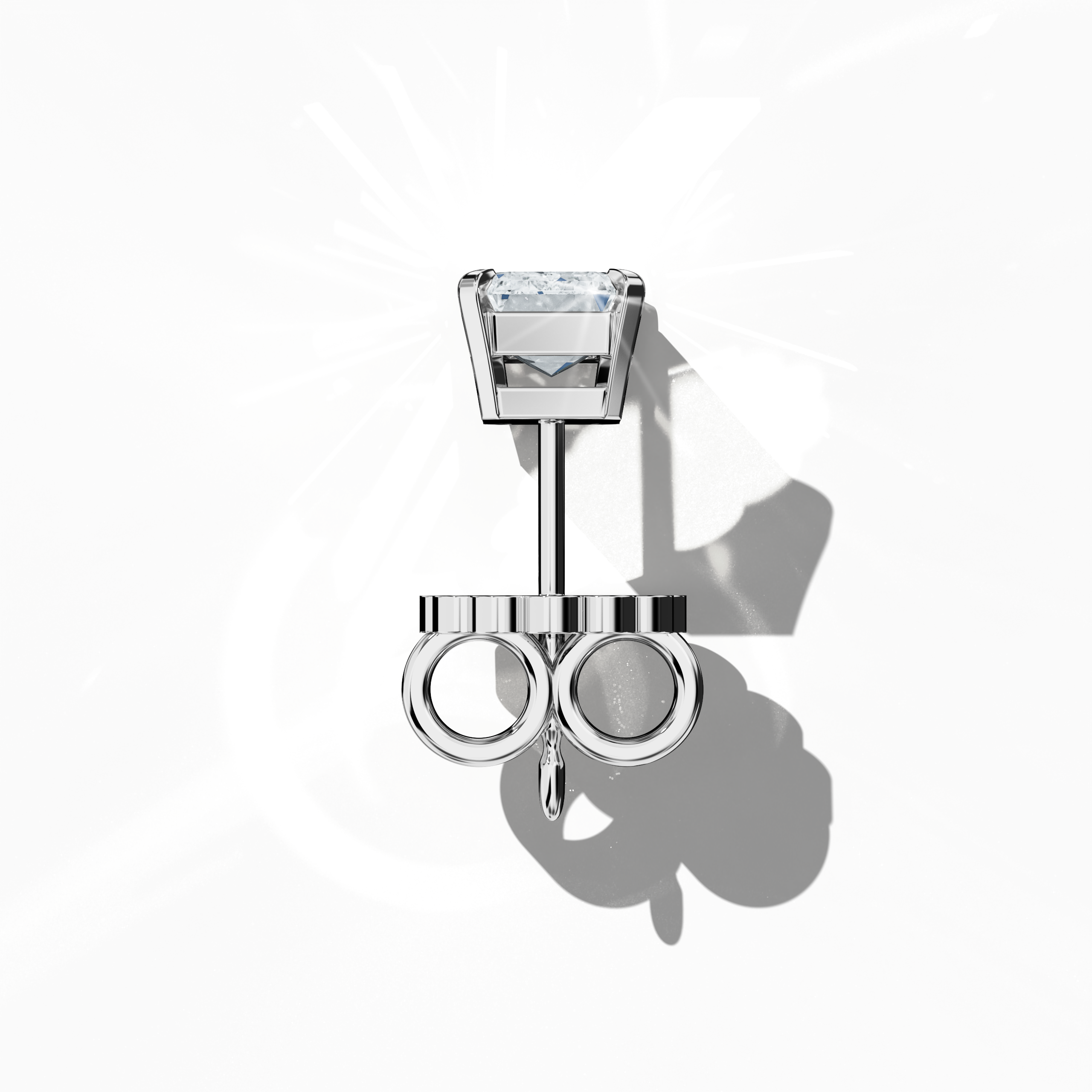 Top view of 1-carat natural emerald earring in 18k white gold with prong setting; emerald stud, 1ct natural emerald, luxury fine jewelry/fine jewellery ear accessory.