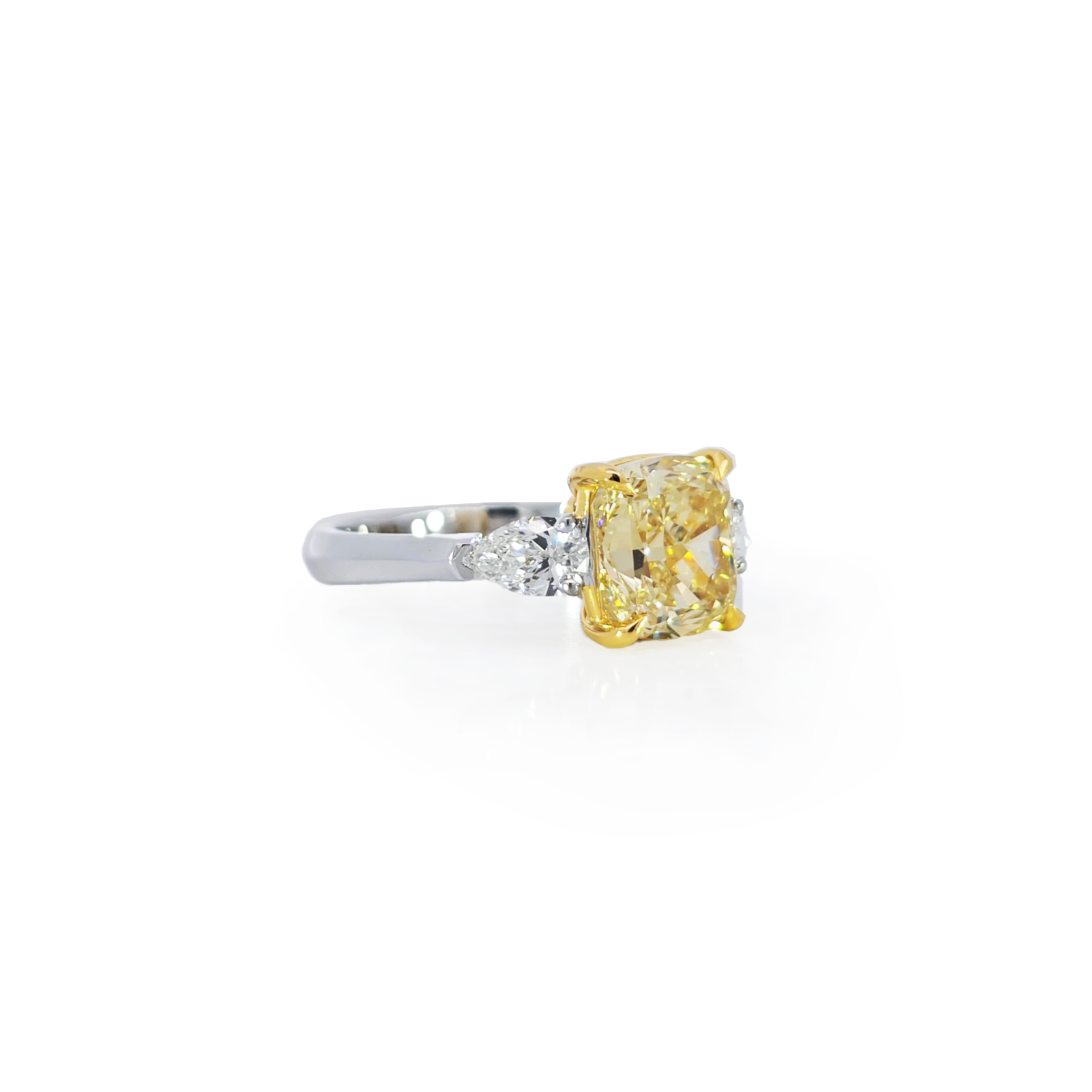 Yellow Cushion pear trio ring