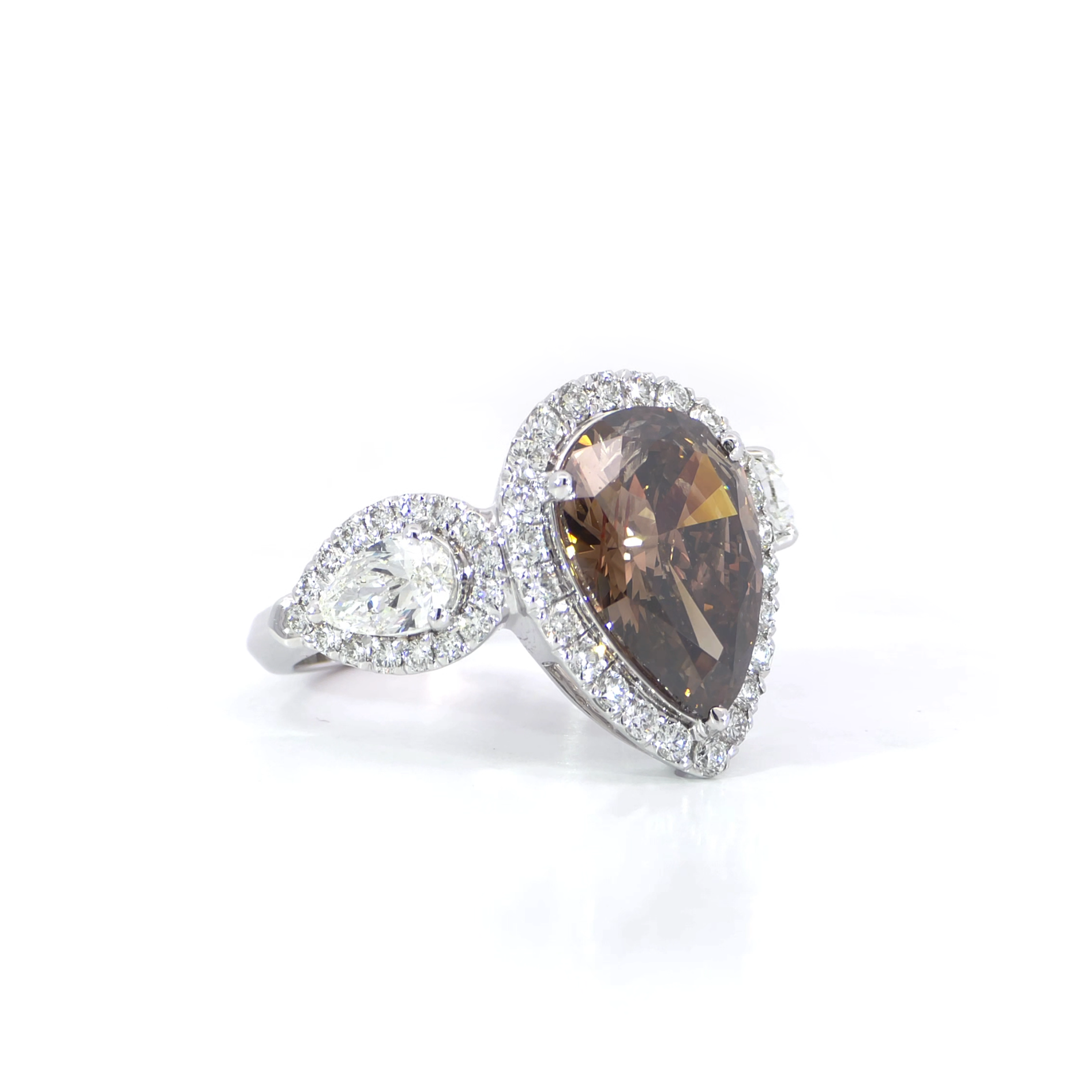Brown diamond pear trio halo ring side view showing 3.05 carat pear cut center with halo setting by Jonga 18K white gold