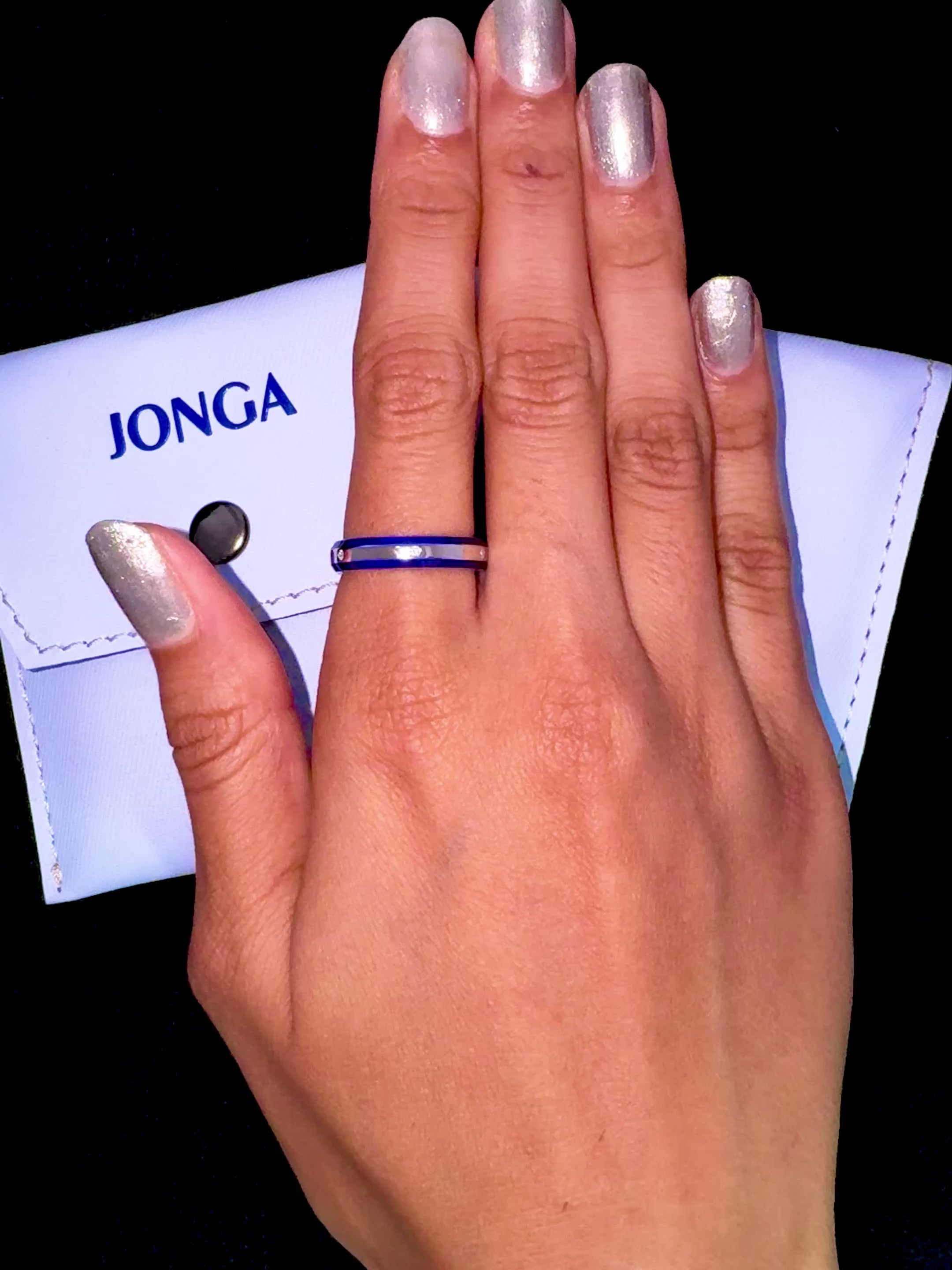 Gracefully worn on her finger, this mesmerizing six diamond enamel ring in white gold with an eye-catching blue enamel finish embodies a fusion of modern artistry and classic elegance. The band features a pristine center line of six scintillating diamonds (up to 0.05 carat total) complemented by a glossy enamel surface that intensifies the rich blue tone. Designations such as Elegant Fusion, Modern Radiance, Timeless Chic, Luxe Harmony, Classic Splendor, and Contemporary Brilliance amplify its allure.