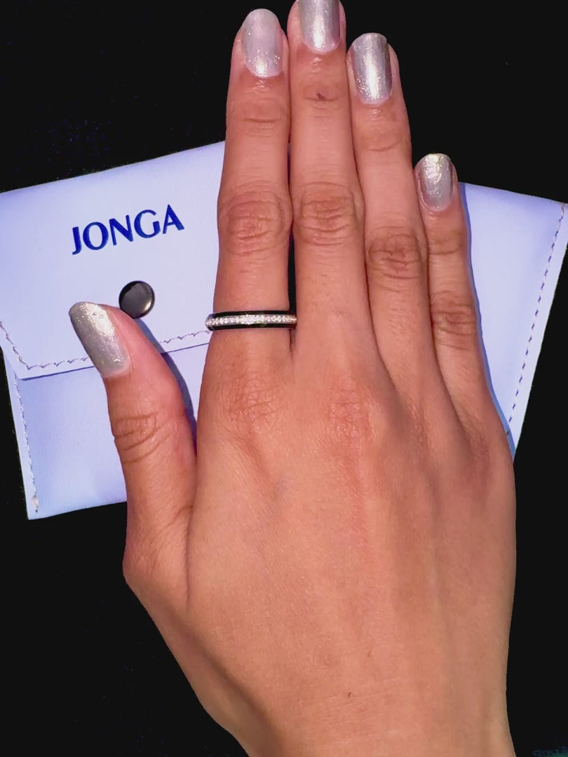 Adorned on her finger, this white gold ring with luxurious black glossy enamel and a stunning 0.35 carat paved center stone epitomizes refined craftsmanship. The pave band, celebrated as Eternity Pave, Pavé Chic, and Carat Pave, is beautifully rendered, showcasing intricate pavé detailing and the pure brilliance of refined white gold. This designer piece exudes modern elegance, luxury, and an impeccable gloss finish.
Keywords: enamel, luxury, pave, designer.