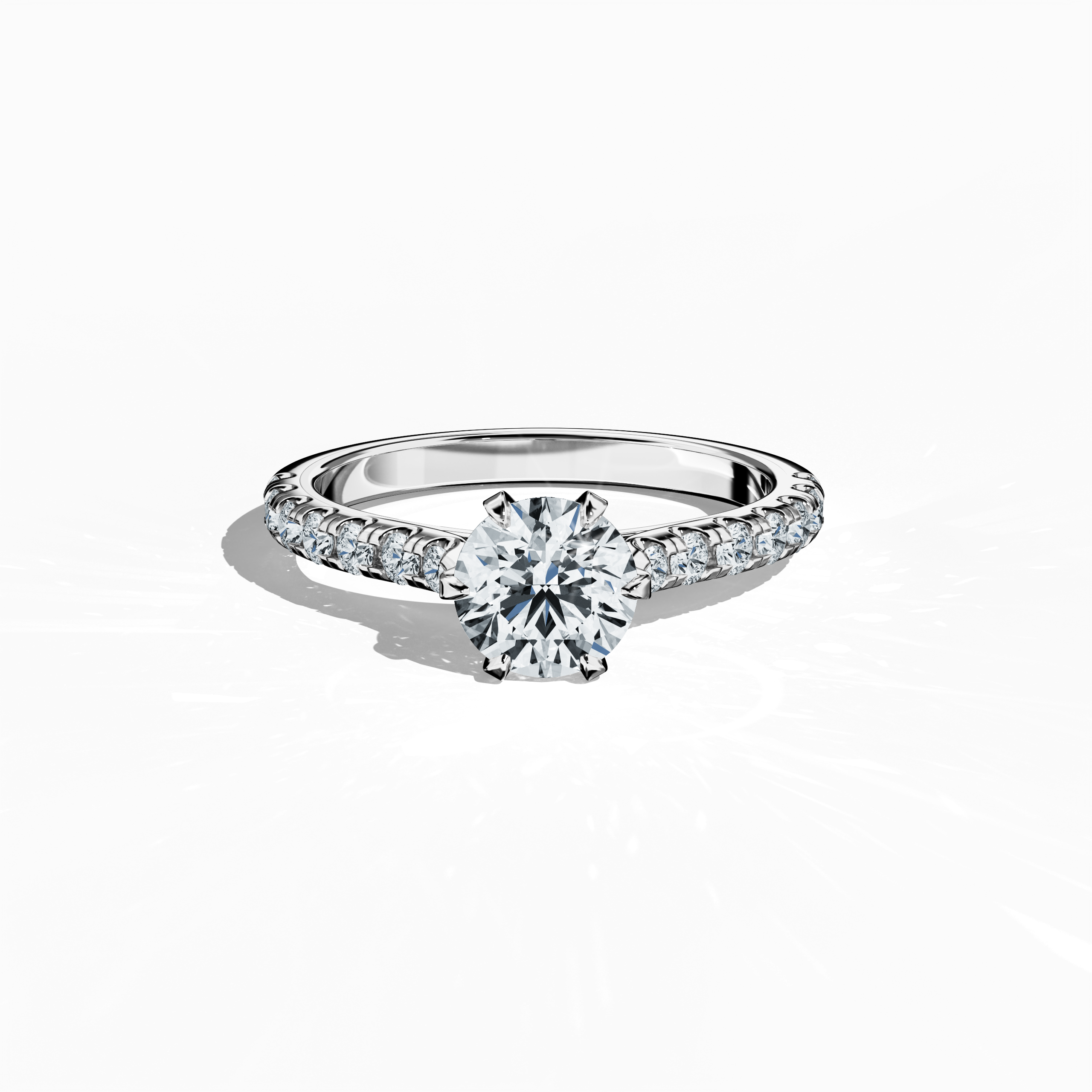 Sleeping front top view of a white gold solitaire paved ring, showcasing a luminous 1 ct center/centre diamond and 0.21 ct side diamonds embedded in a delicate diamond slim band with a four nail prong setting. The image emphasizes refined craftsmanship and subtle brilliance, ideal as an engagement ring, wedding band, or fine jewelry/fine jewellery piece. Keywords: white gold, paved ring, diamond slim band, engagement, luxury, 1.21 ct, refined design.
