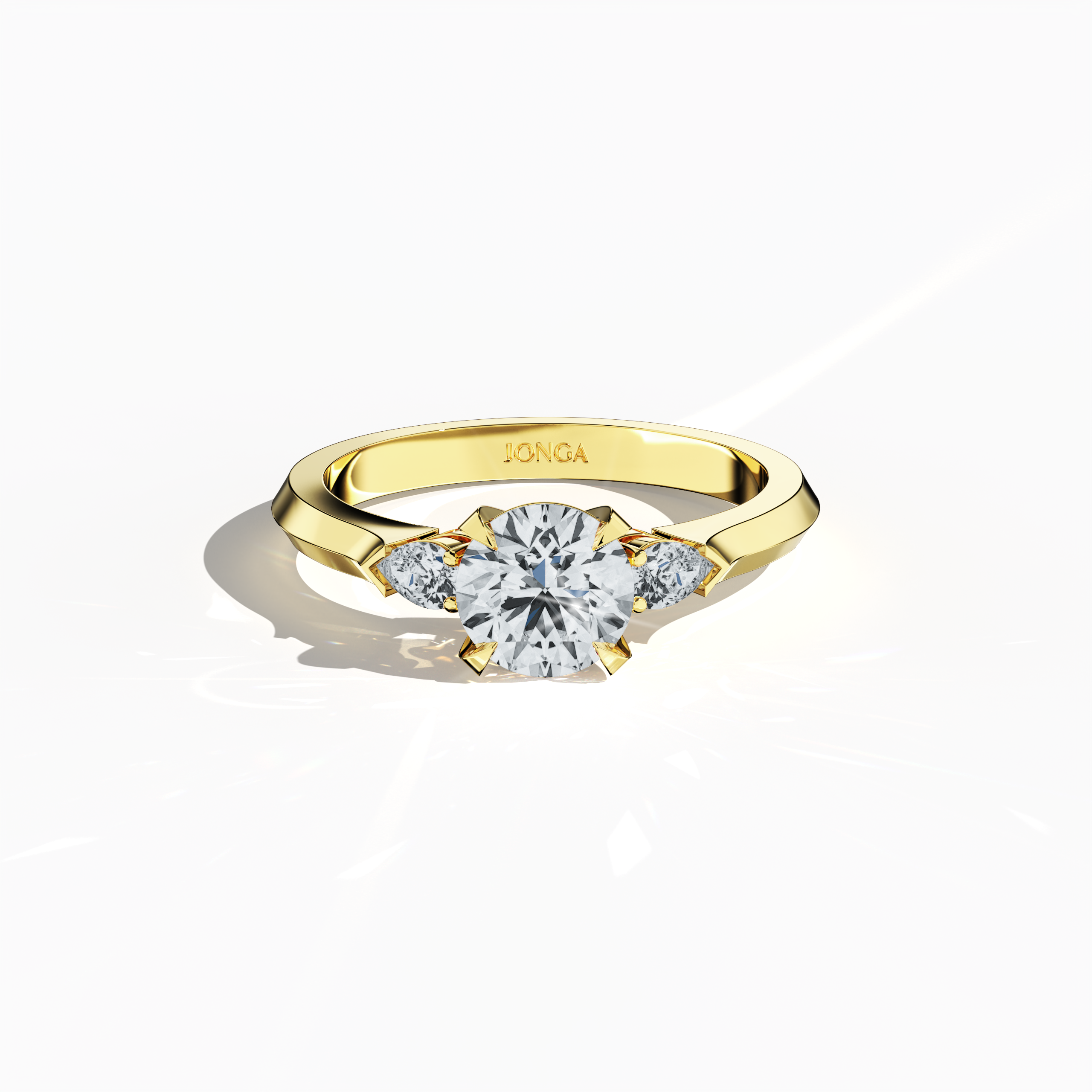 Sleeping front top view of a yellow gold trio diamond ring showcasing 1.30 ct natural diamonds—a 1 ct round center/centre diamond with two pear‐shaped side diamonds (0.30 ct total) set in a slim band with a four‐nail prong setting. The image highlights its meticulous craftsmanship and warm glow, ideal as an engagement ring, wedding band, or fine jewelry/fine jewellery piece. Also known as a trilogy ring, three‐stone ring, three‐diamond ring, trinity ring, and triptych ring design. Keywords: yellow gold.