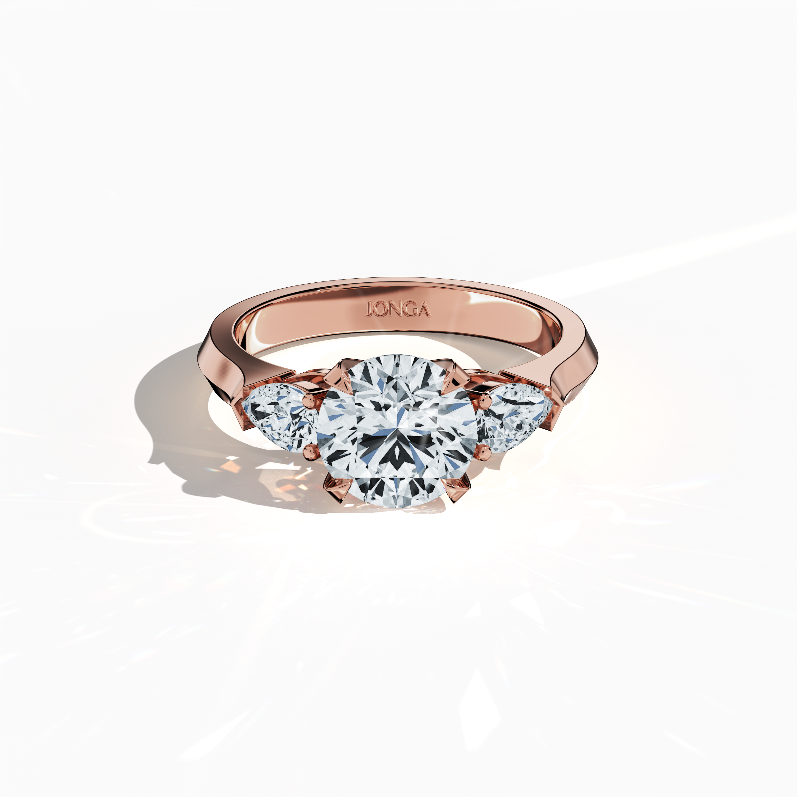 Sleeping front top view of a rose gold trilogy diamond ring showcasing 2.55 ct natural diamonds—a brilliant 2 ct round center/centre diamond with two pear‐shaped side diamonds (0.55 ct total) set in a graceful band with a four‐nail prong setting. The image highlights exquisite craftsmanship and a warm glow, ideal as an engagement ring, wedding band, or fine jewelry/fine jewellery piece. Also known as a trilogy ring, three‐stone ring, three‐diamond ring, trinity ring, and triptych ring design.