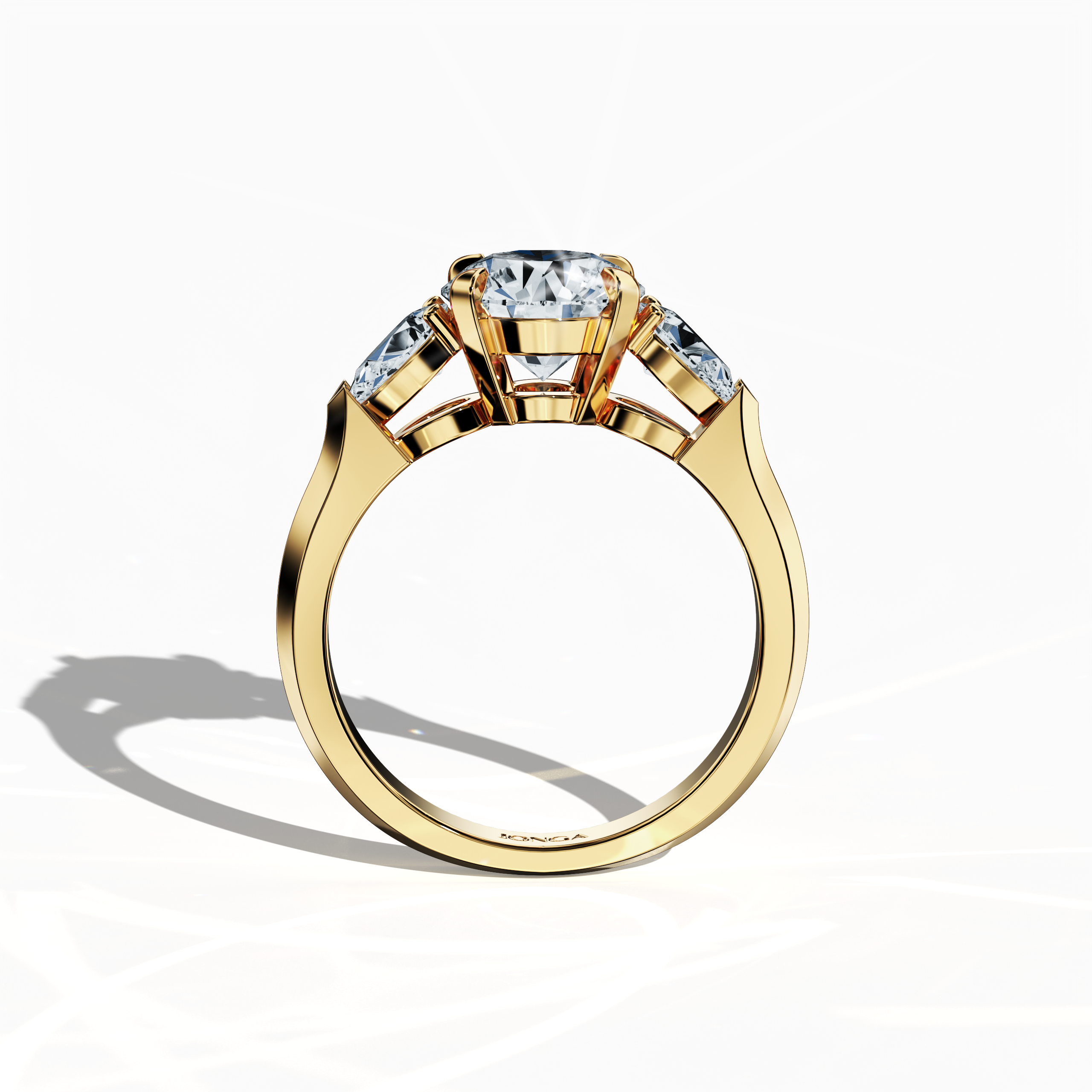 Standing front view of a yellow gold trilogy diamond ring featuring 2.55 ct natural diamonds, with a dazzling 2 ct round center/centre diamond flanked by two pear‐shaped side diamonds (0.55 ct total) in a sleek band with a secure four‐nail prong setting. The design exudes contemporary elegance and vibrant sparkle as an engagement ring, wedding band, or fine jewelry/fine jewellery statement piece. Also known as a trilogy ring, three‐stone ring, three‐diamond ring, trinity ring, and triptych ring design.