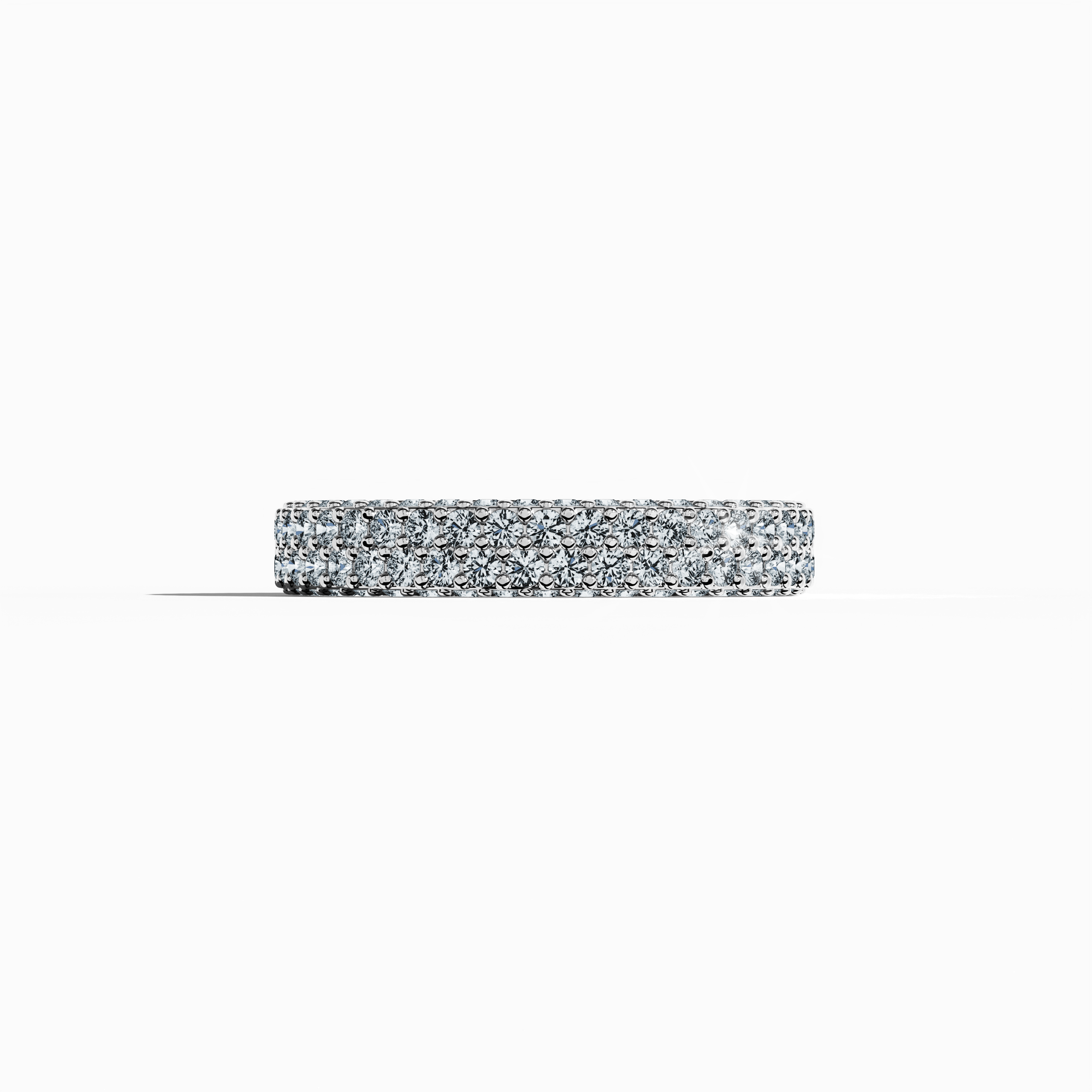 "Elegant white gold 4-row diamond band in a sleeping front view, showcasing up to 2.10 carats of meticulously set micro diamonds. This refined design, known globally as an eternity band, classic pave band, multi-row diamond band, and stacked diamond band, radiates an icy gold brilliance with subtle engravings and harmonious contours. The image exudes modern luxury and timeless sophistication with delicate reflections. Keywords: white gold, micro diamonds, luxury, elegance, refined design.