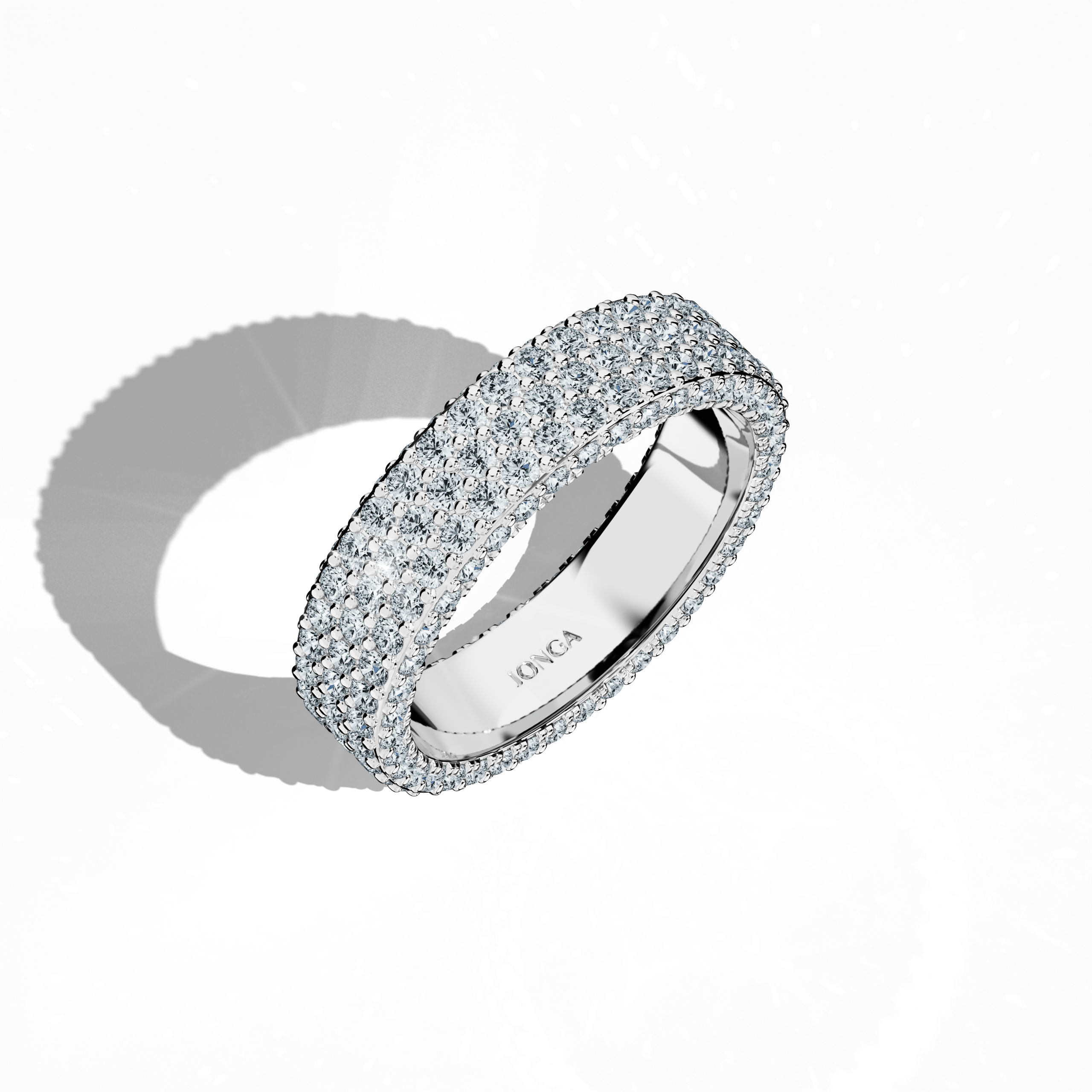 Admire the sophisticated elegance of our white gold 5‑row diamond band in a standing front top side view. Exquisitely crafted with up to 2.55 carats of micro diamonds arranged in a harmonious pattern, the design nods to illustrious 4‑row styles—Classic, Vintage, Contemporary, Modern, Minimalist, Ornate, Channel‑Set. Its radiant, icy white finish and sterling luster epitomize refined luxury and contemporary charm. Keywords: white gold, diamond band, luxury, elegant, refined.