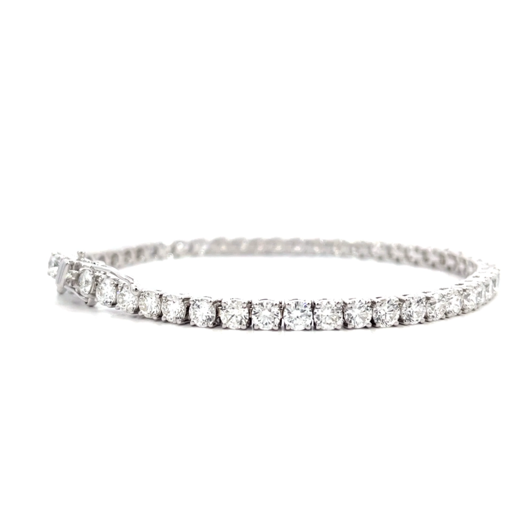 Tennis Bracelet showing 6.82 carat D-F color VS clarity diamonds in luxury 18K white gold setting
