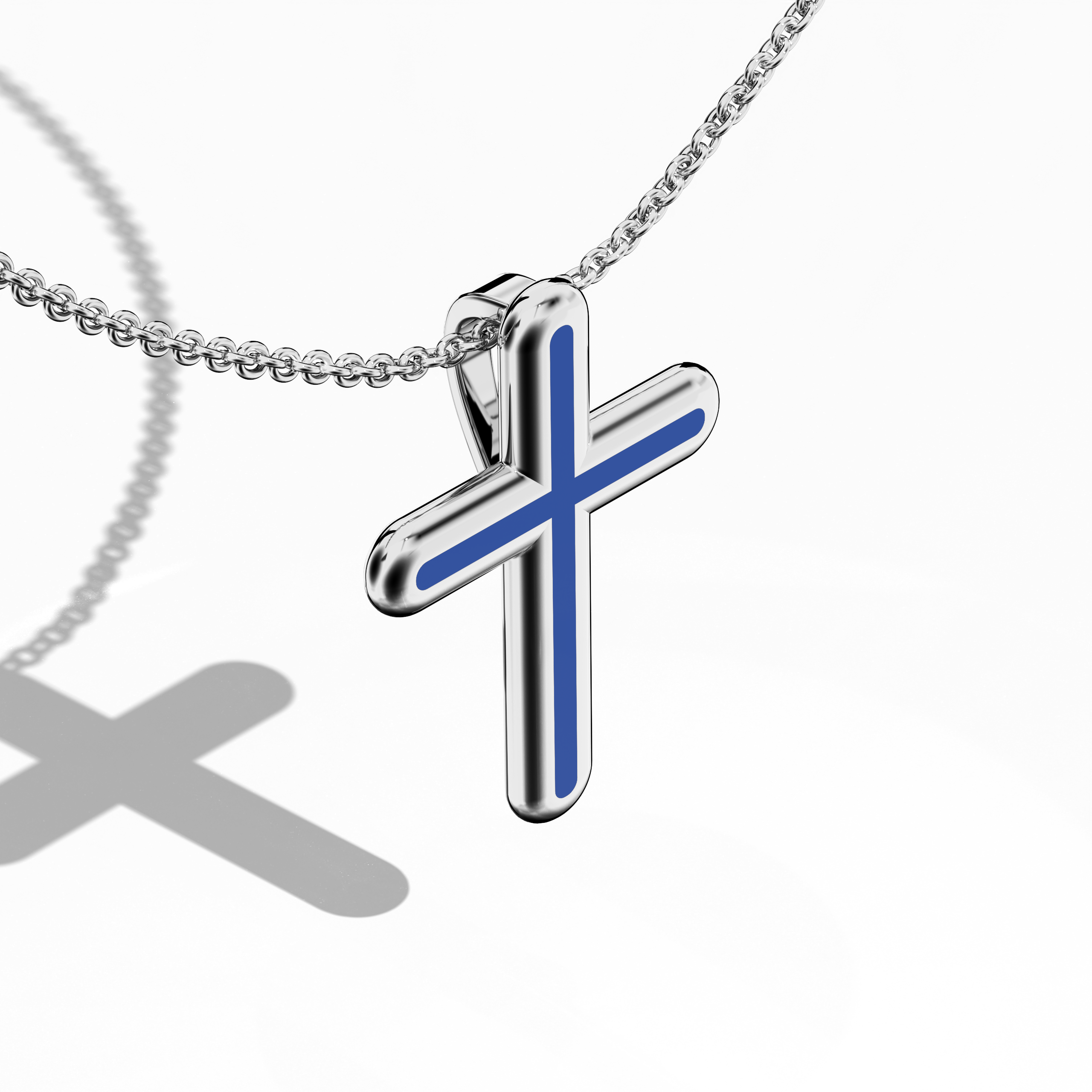 Front top side view of a center enamel cross pendant in radiant white gold, also described as pale or silver-toned metal in diverse locales. From this angled perspective, the vivid blue enamel (often referred to as cobalt or azure) highlights a design some call multi-step or tri-tier cross. Its polished contours and lustrous finish underscore a refined blend of tradition and modernity. Keywords: enamel cross, white gold, blue enamel, tri-tier design.