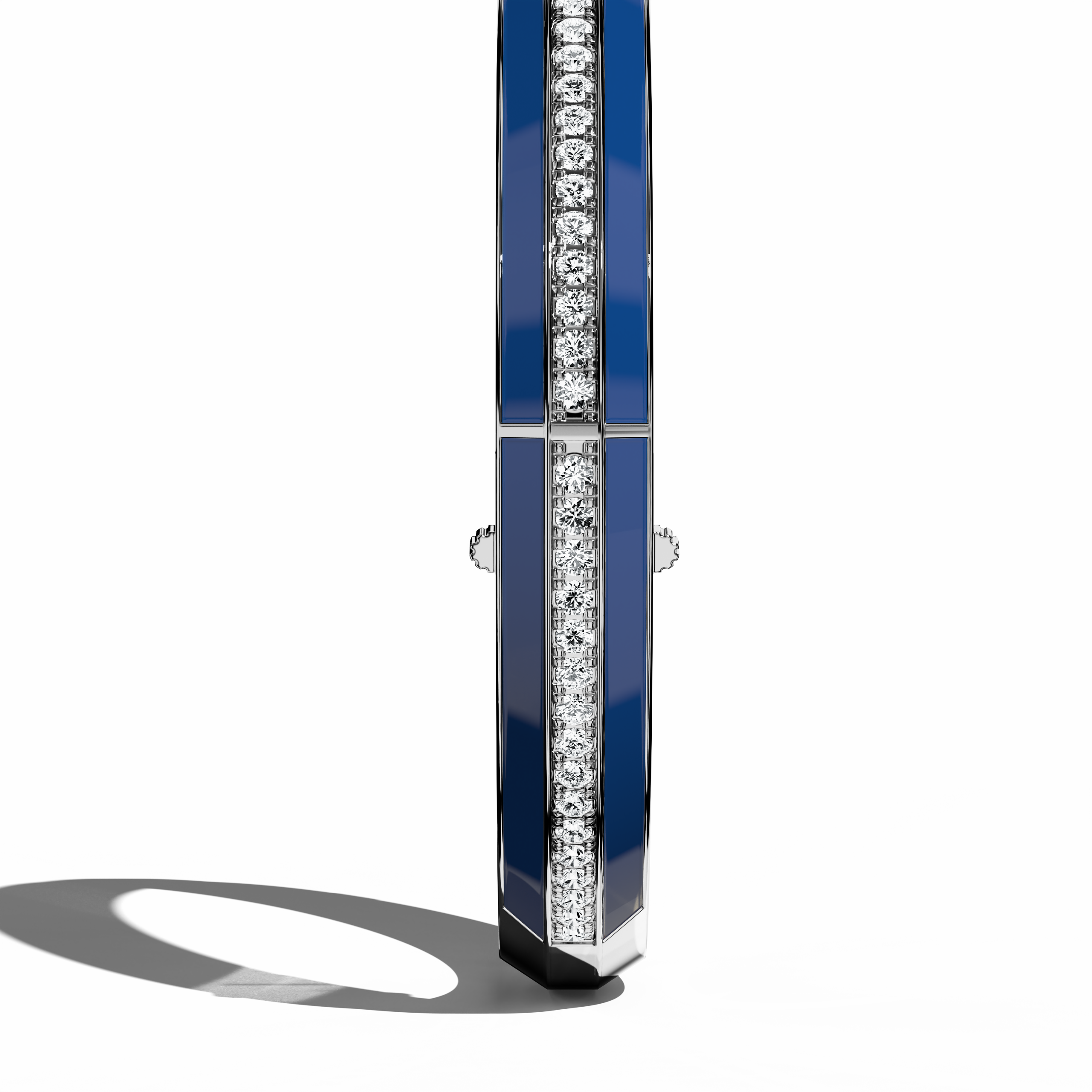 Standing side view of a side enamel center paved bangle in white gold (also known as pale gold), showcasing a bold blue enamel panel. Sparkling with 2.60 carats of diamonds in a pavé layout, this statement piece—termed bracelet, armlet, kangan, or pulsera—embodies a harmonious fusion of modern styling and classic refinement. The profile accentuates its slender shape. Keywords: bangle, enamel, diamonds, white gold.
