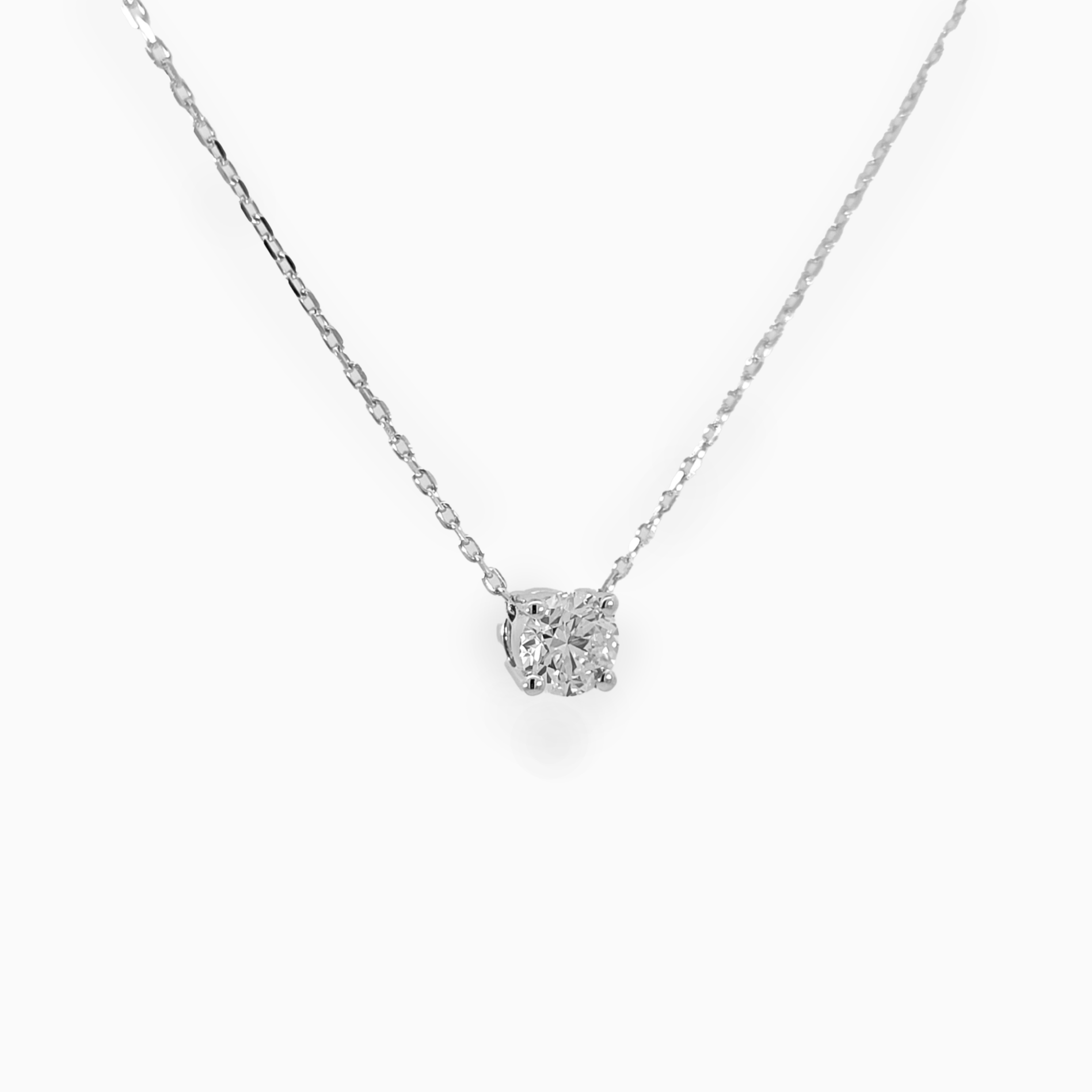 Brilliant Pendant side view showing 0.22 carat diamond in polished 18K white gold setting
