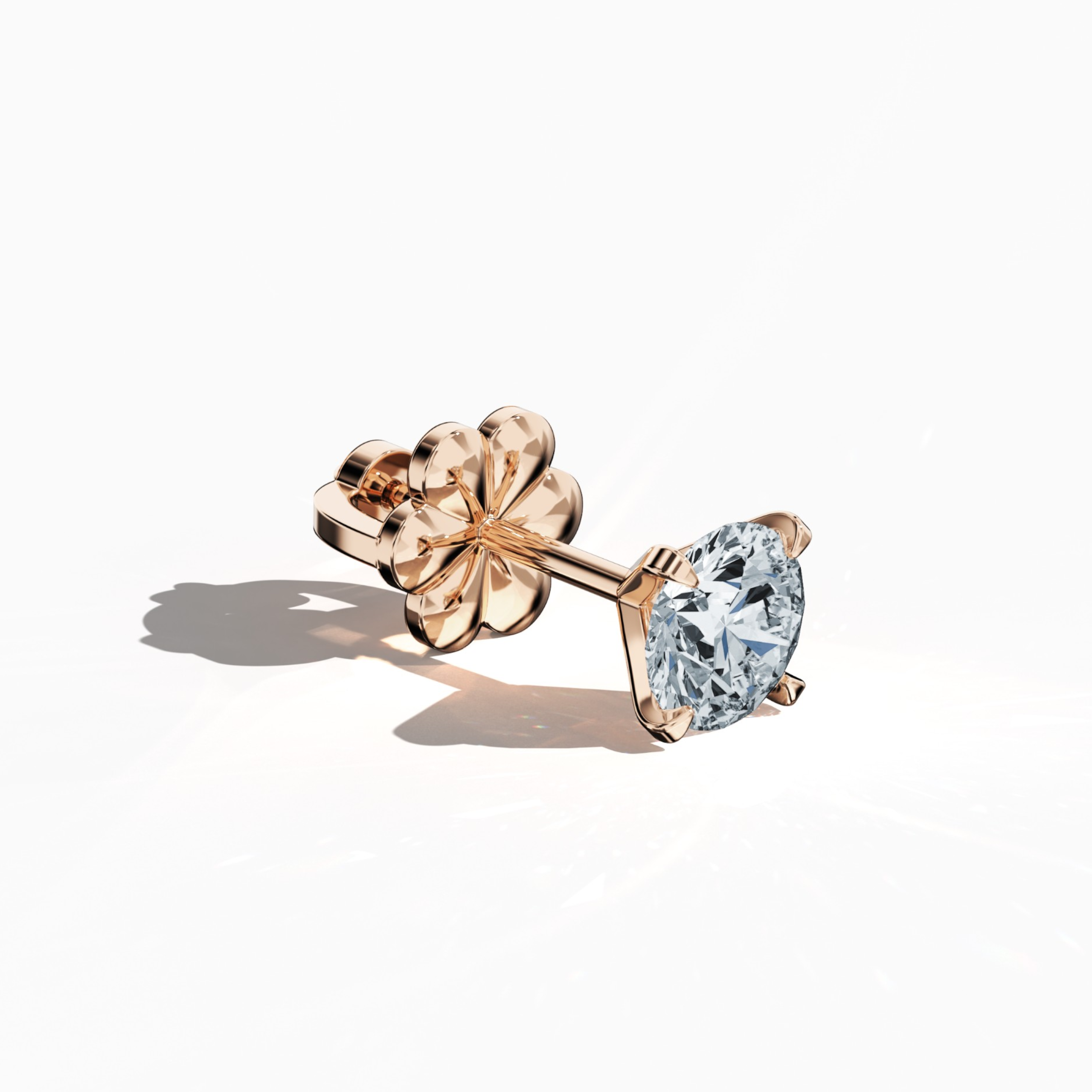 Front top side view of 2 carat natural diamond earring in 18k rose gold with nail prong setting; diamond stud, 2ct solitaire diamond, luxury fine jewelry/fine jewellery ear accessory.
