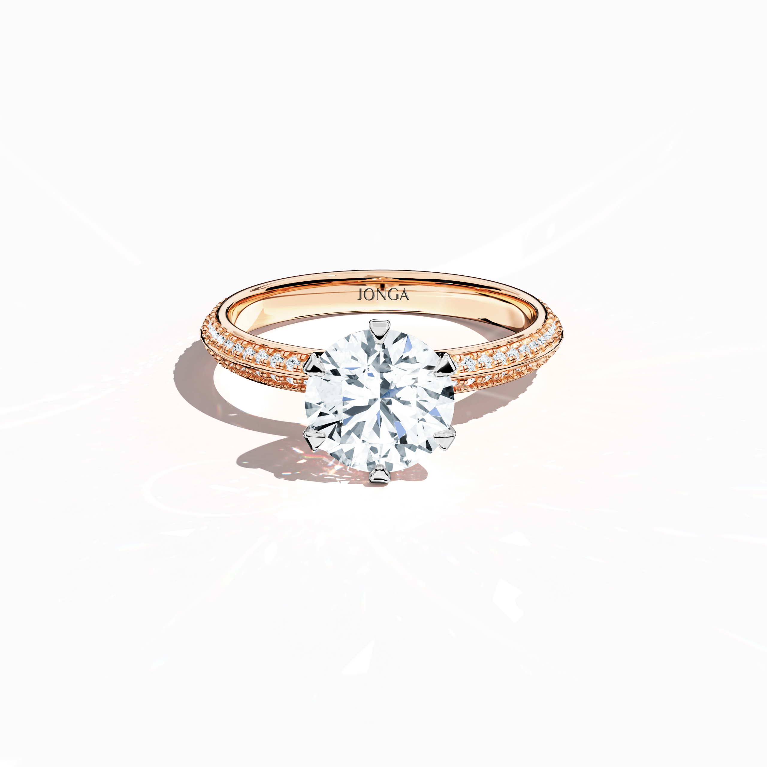 Elegant 2.40 ct diamond ring in a six‑prong setting with a pavé band—comprising a 2 ct center stone and 0.40 ct side stones—rendered in soft rose gold (blush/pink gold) with a dual‑tier, step‑accented band and a defined central line. Captured from a front top view, this fine jewelry/fine jewellery ring highlights its luminous pavé detailing and gentle, romantic finish.