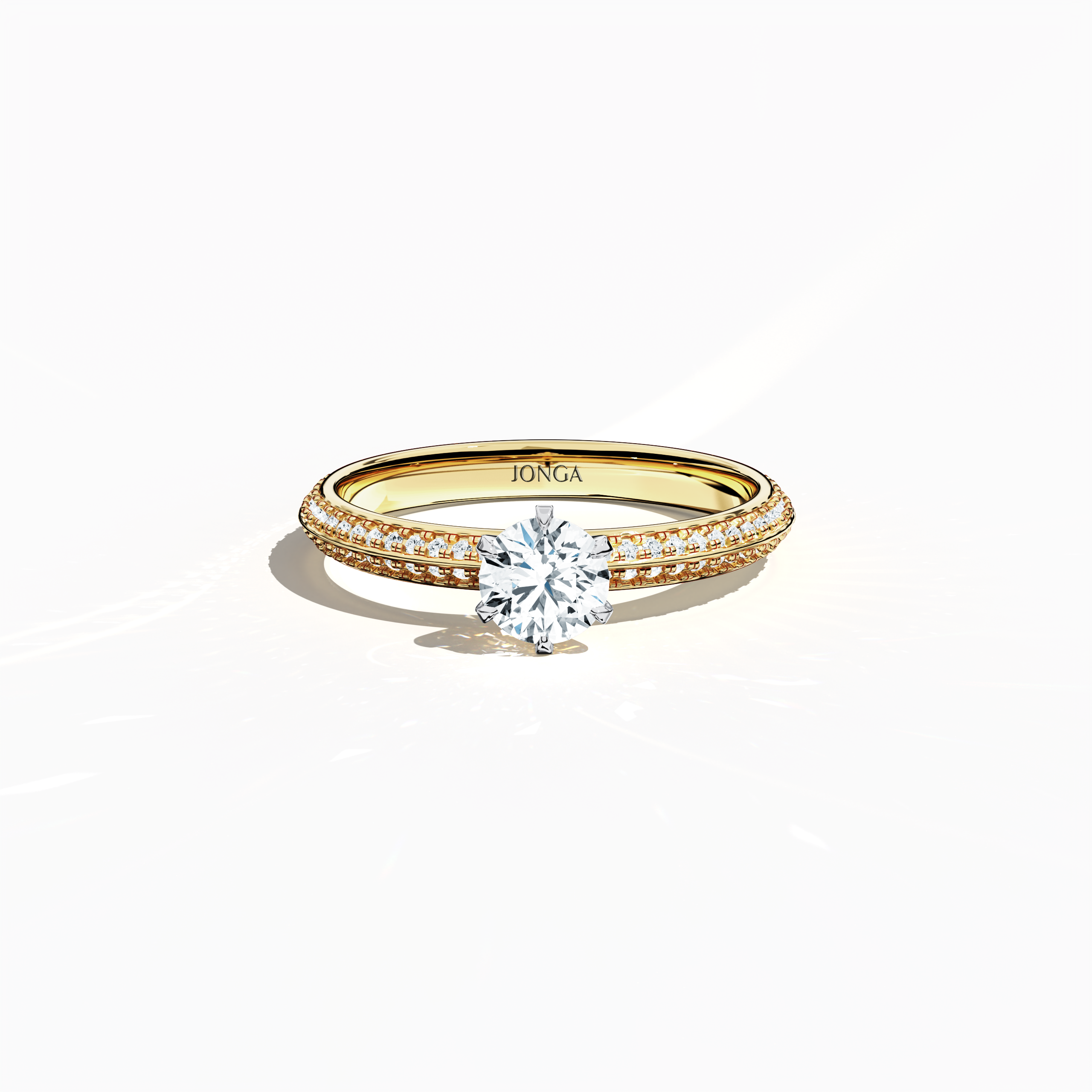 Elegant 0.90 ct diamond ring in a six‑prong setting with a pavé band – including a 0.50 ct center diamond and 0.40 ct side stones – rendered in classic yellow gold with a dual‑tier, step‑accented band and a defined midline. Captured from a front top view, this fine jewelry/fine jewellery ring highlights its luxurious pavé detail and warm radiance.