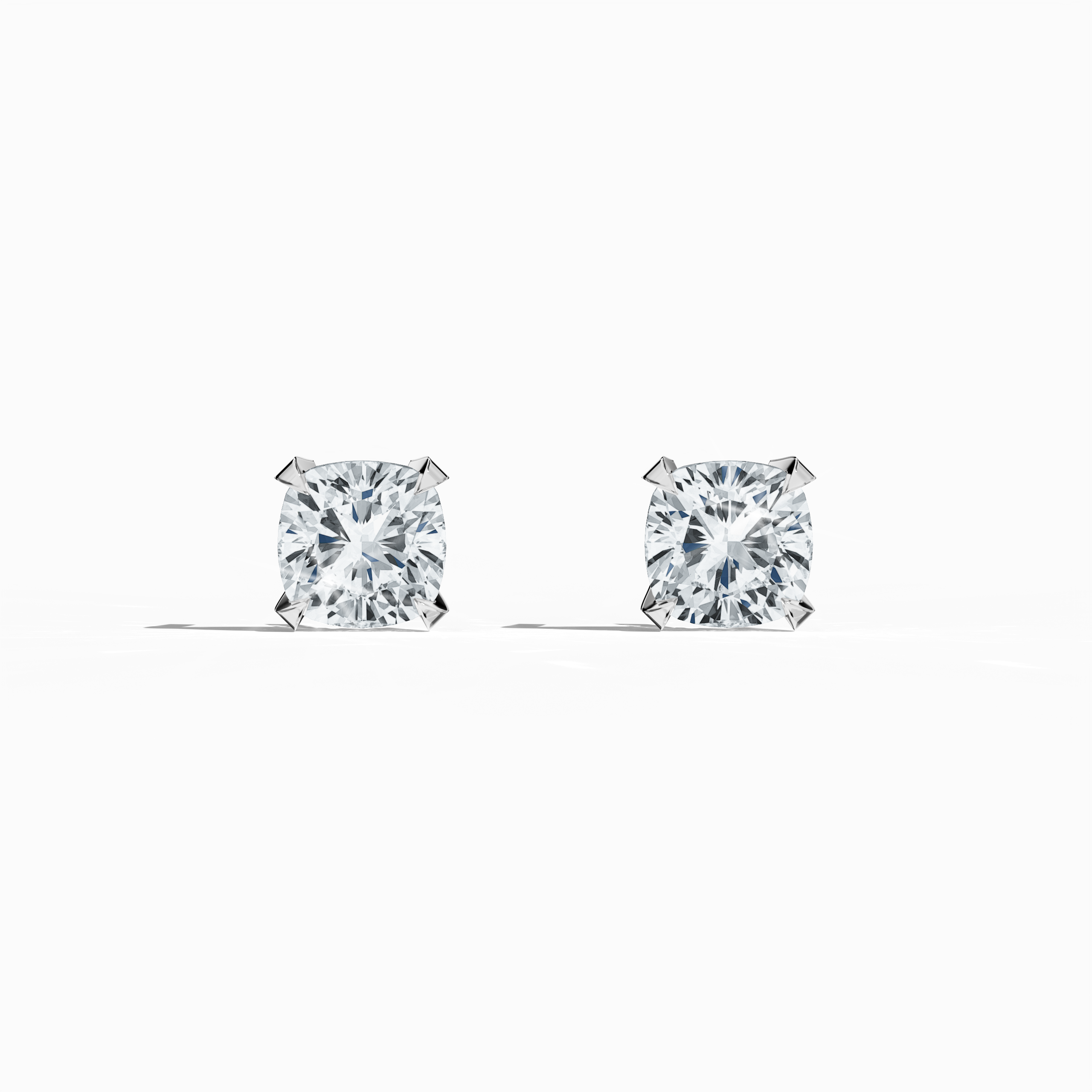 Front view of 1-carat natural diamond earring in 18k white gold with nail prong setting; features a cushion cut diamond (also known as cushion brilliant or pillow cut diamond in various regions) – luxury fine jewelry/fine jewellery ear accessory.