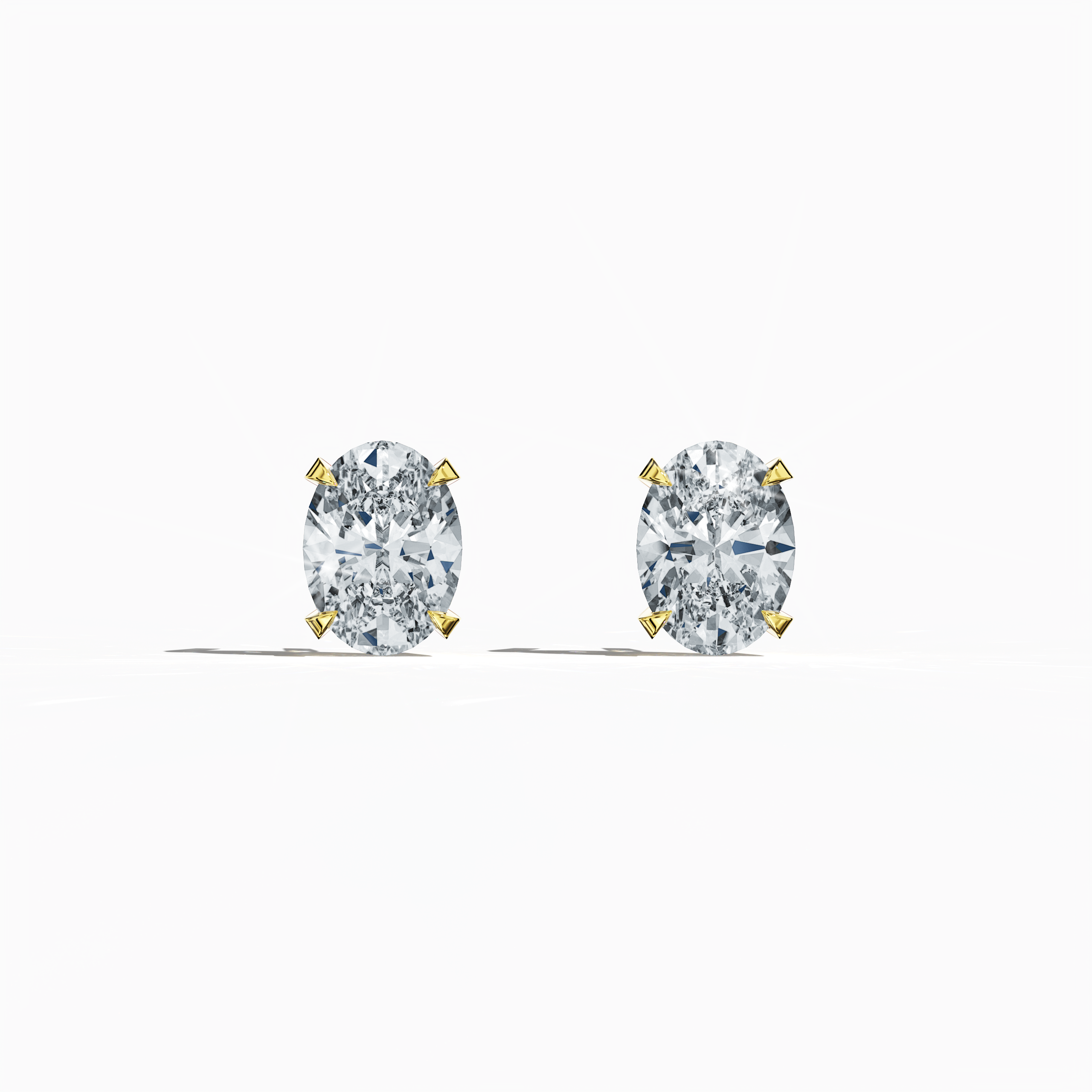Front view of 1-carat natural diamond earring in 18k yellow gold with nail prong setting; features an oval cut diamond (also known as oval brilliant or elongated oval in some regions) – luxury fine jewelry/fine jewellery ear accessory.
