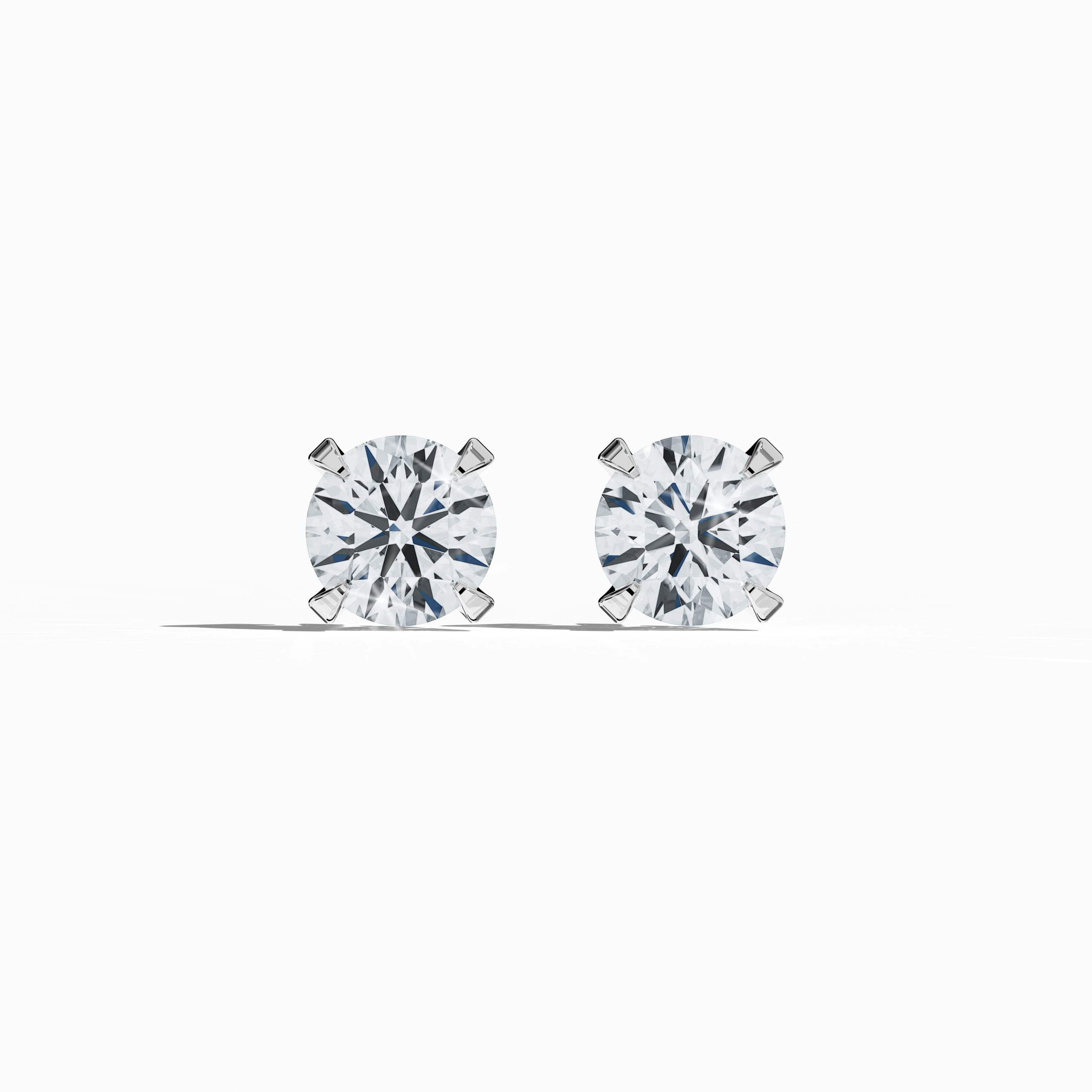 Front view of 2 carat natural diamond stud earrings in classic basket and Nail Prong/claw settings, crafted in 18k white gold.
