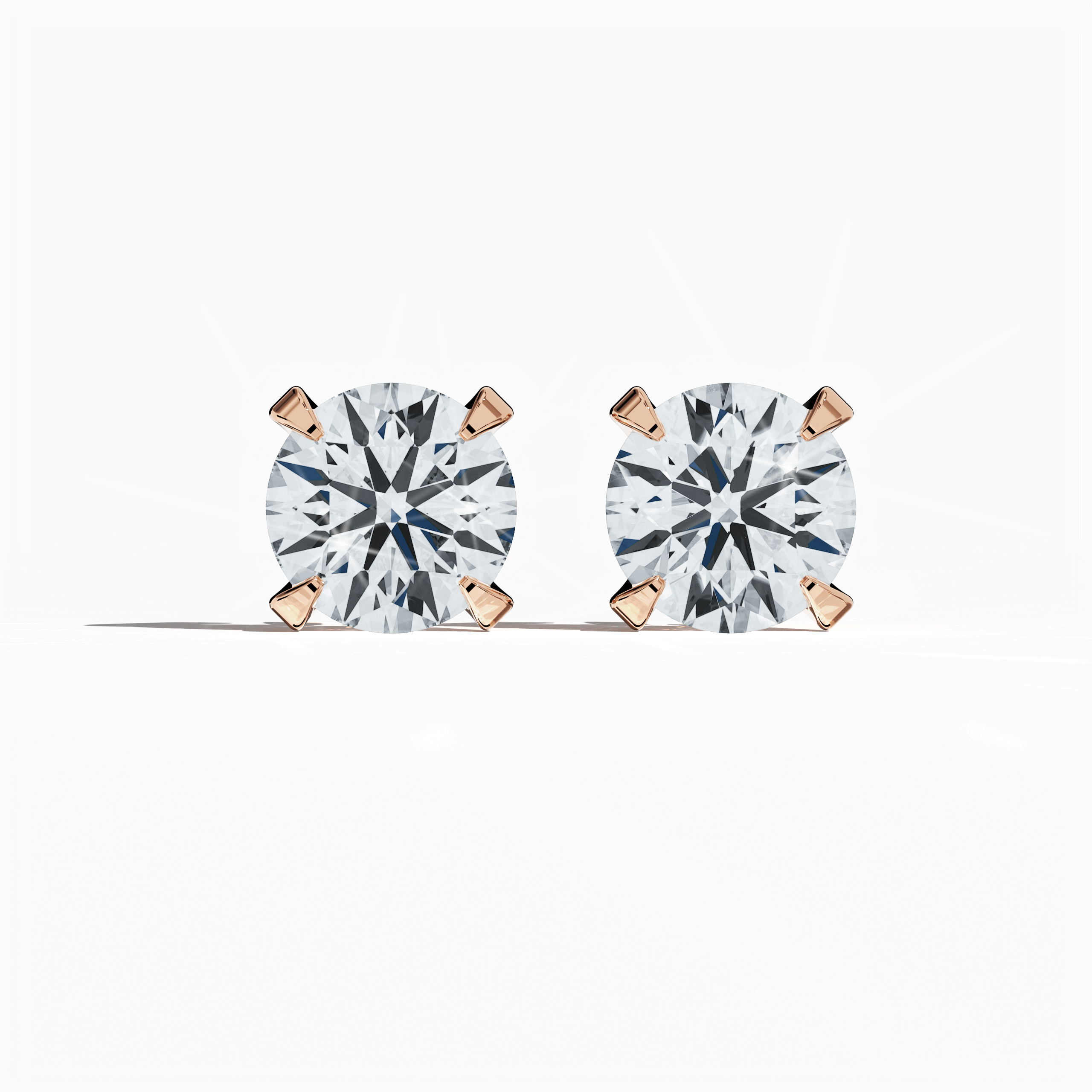 Front view of 4 carat natural diamond stud earrings in classic basket and Nail Prong/claw settings, crafted in 18k rose gold.