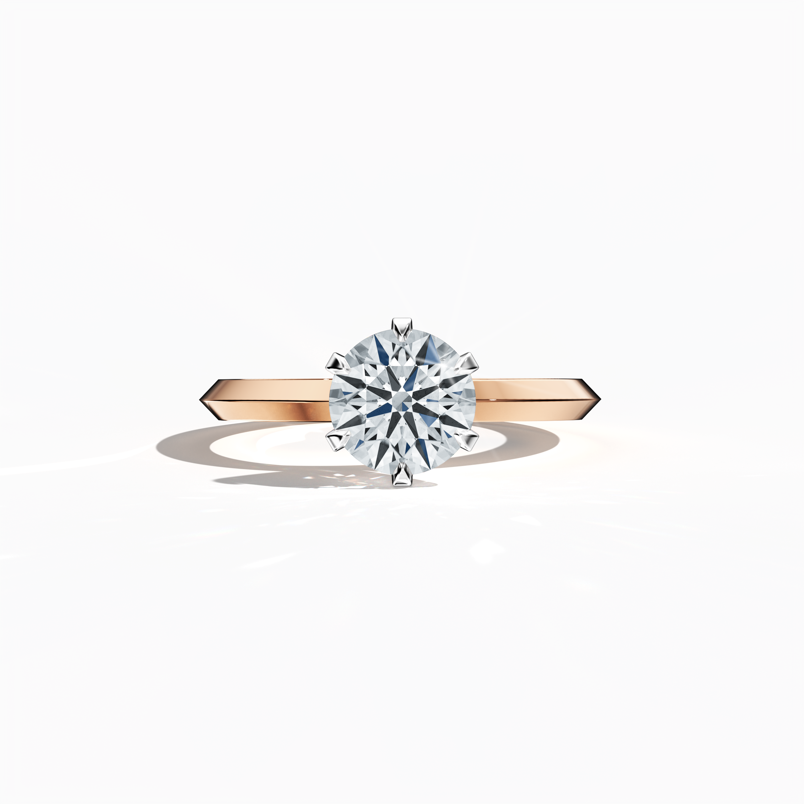 Solitaire diamond ring with a 1 carat center diamond in a six-baby claw prong setting and a dual-step band with a sharp central line, set in a soft rose gold band (pink/blush gold). Displayed in a sleeping front view, this exquisite fine jewelry/fine jewellery piece exudes delicate warmth and modern elegance.