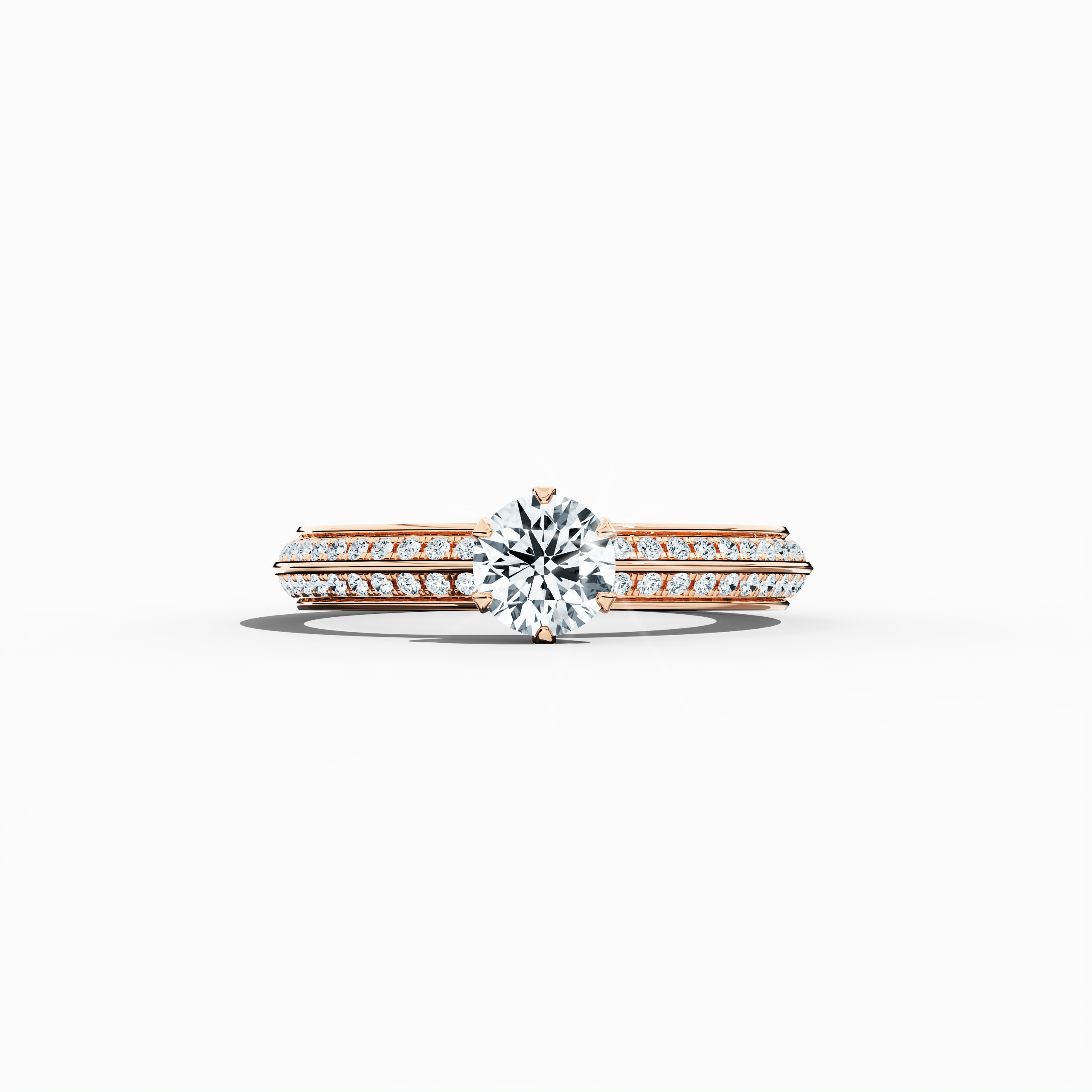 Solitaire paved ring with 0.90 ct total diamonds – featuring a 0.50 ct center diamond and 0.40 ct pavé side stones – set in a soft rose gold band with a modern two‑step band design and a sharp central line. Shown in a sleeping front view on a flat surface, this fine jewelry/fine jewellery ring exudes a warm, romantic glow and refined elegance.